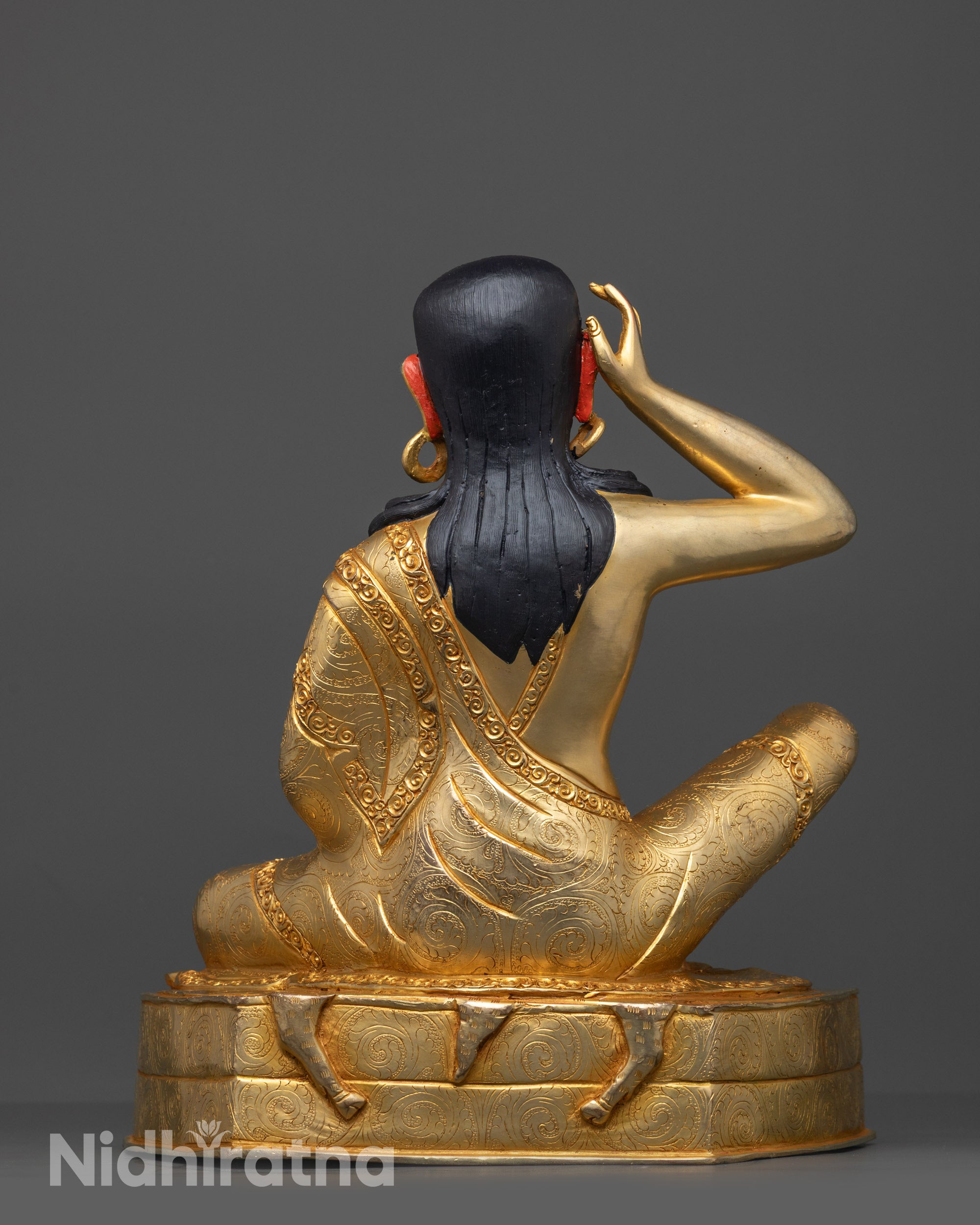 Back view of Milarepa Statue highlighting intricate carvings and Nepalese artisan craftsmanship