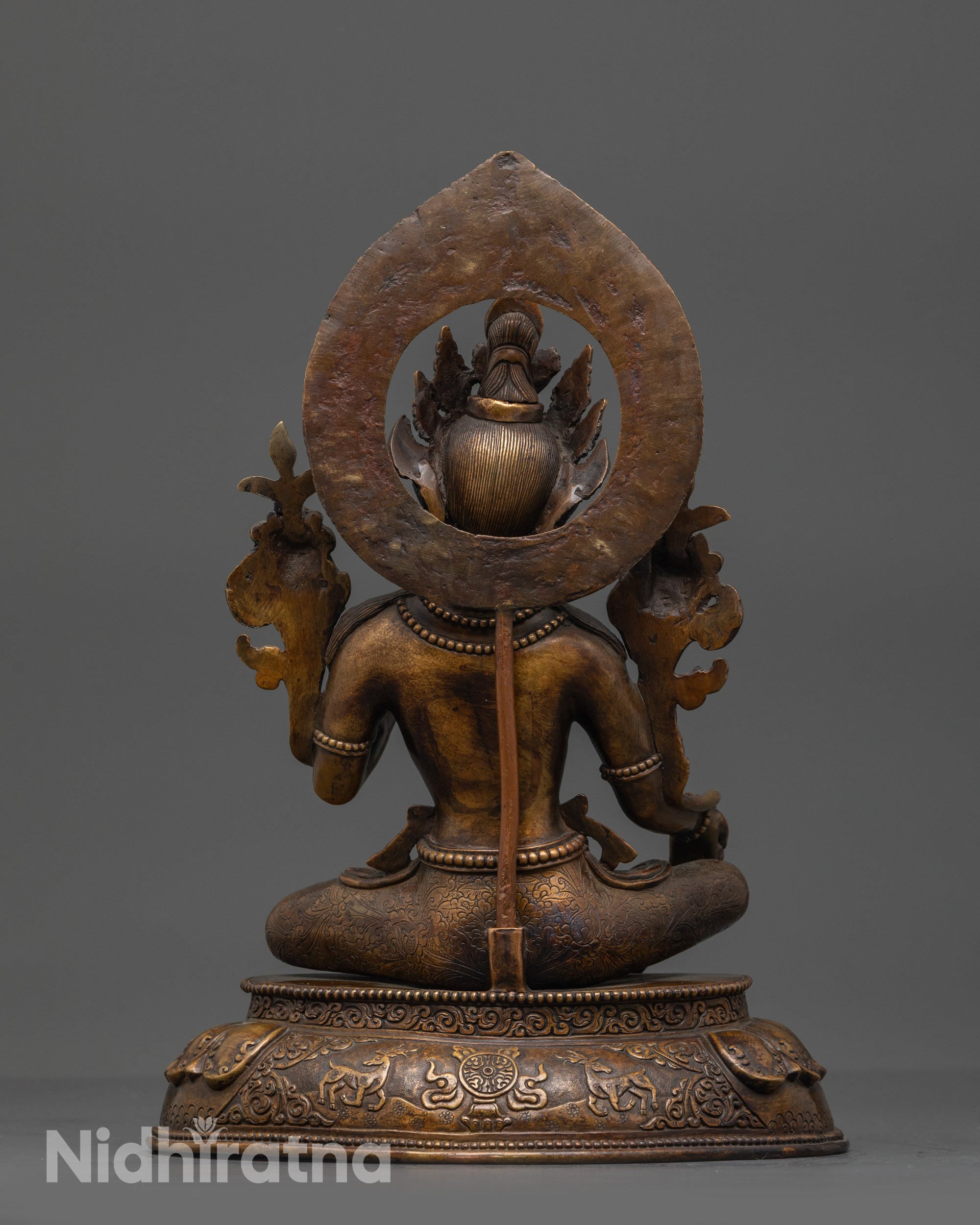 Back view of Mother Tara Statue showing intricate carvings and oxidized copper finish
