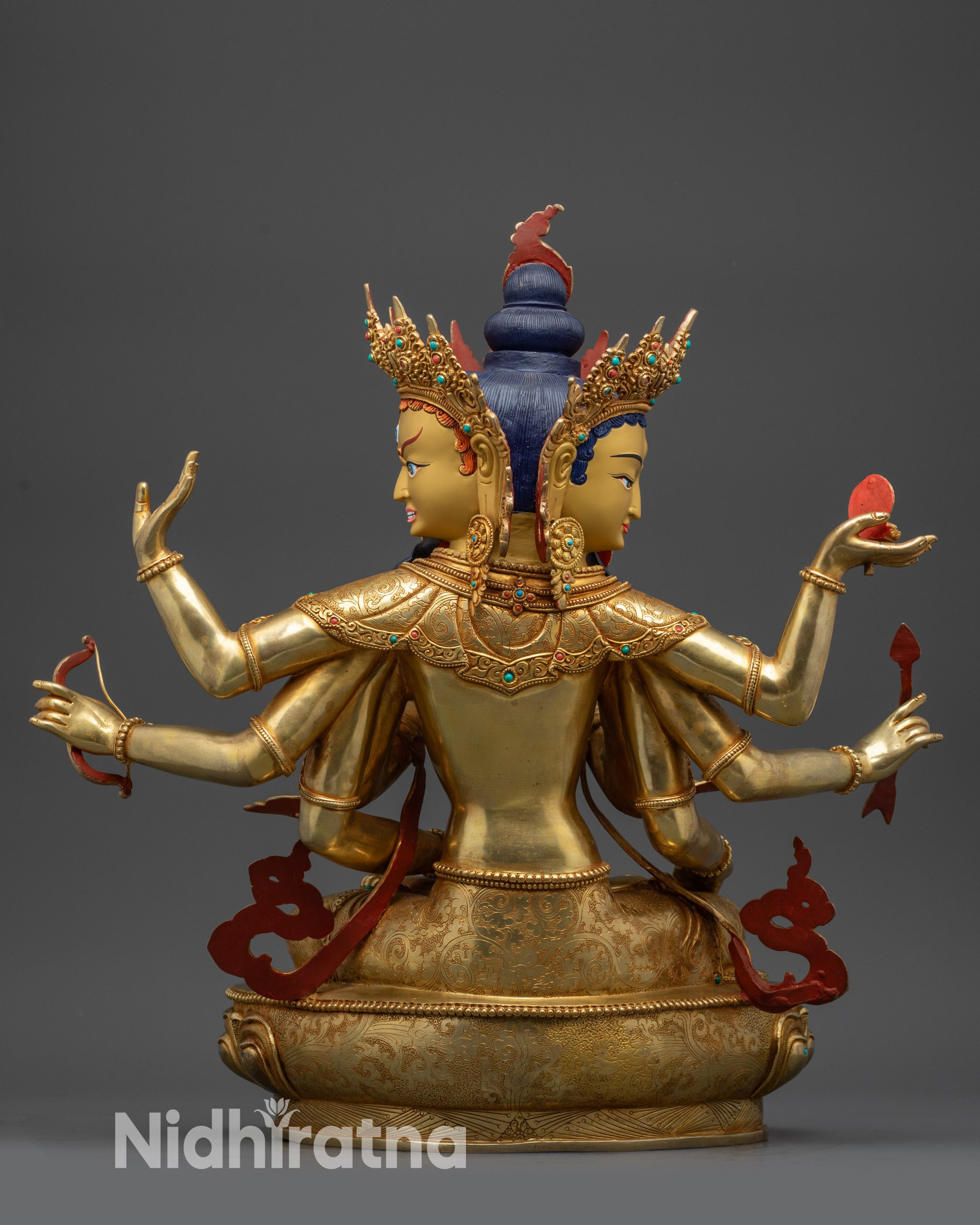 Back view of Namgyalma Ushnishavijaya statue showing intricate carvings and gold-gilded body