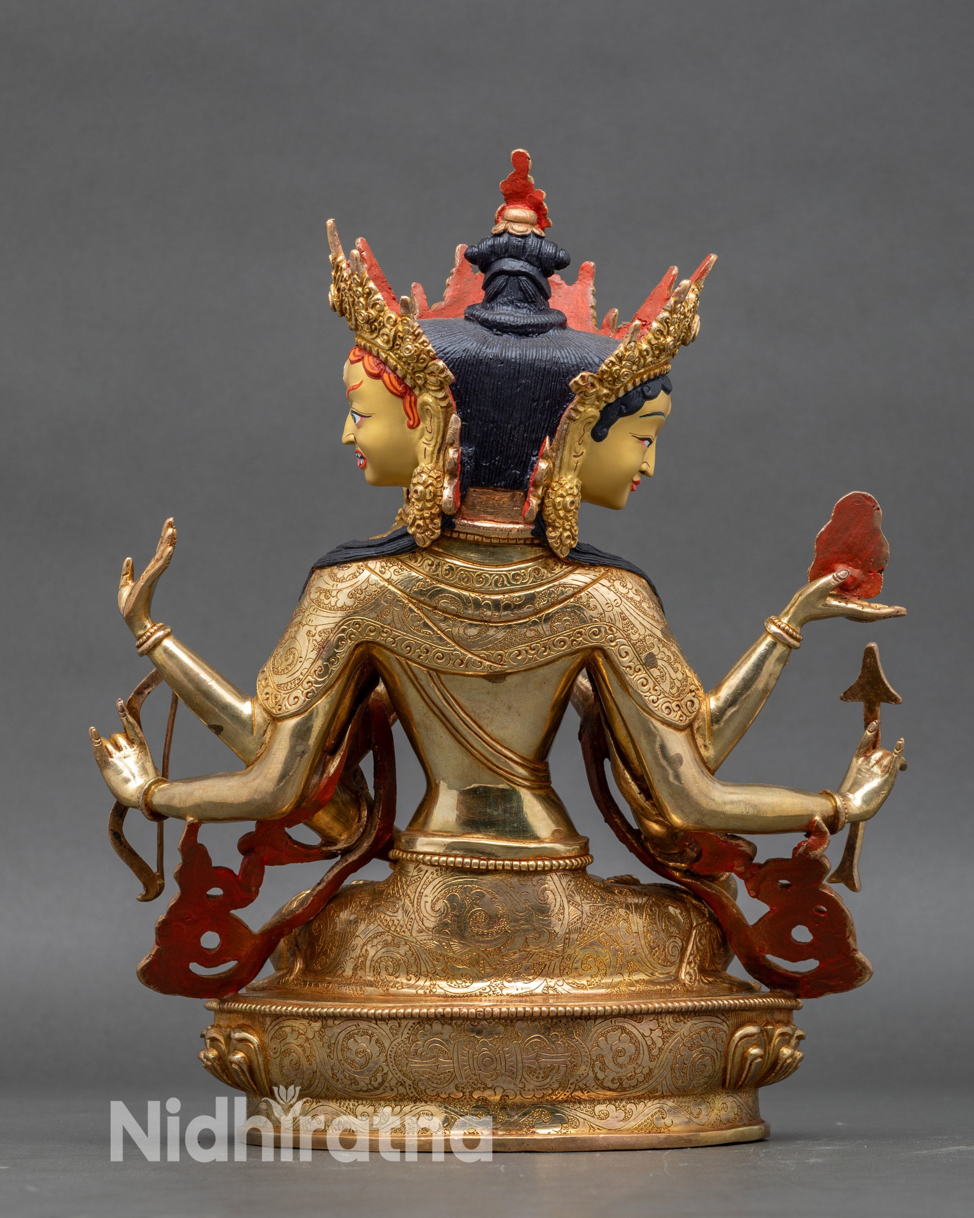 Back view of Namgyalma statue with detailed robe patterns and crown structure