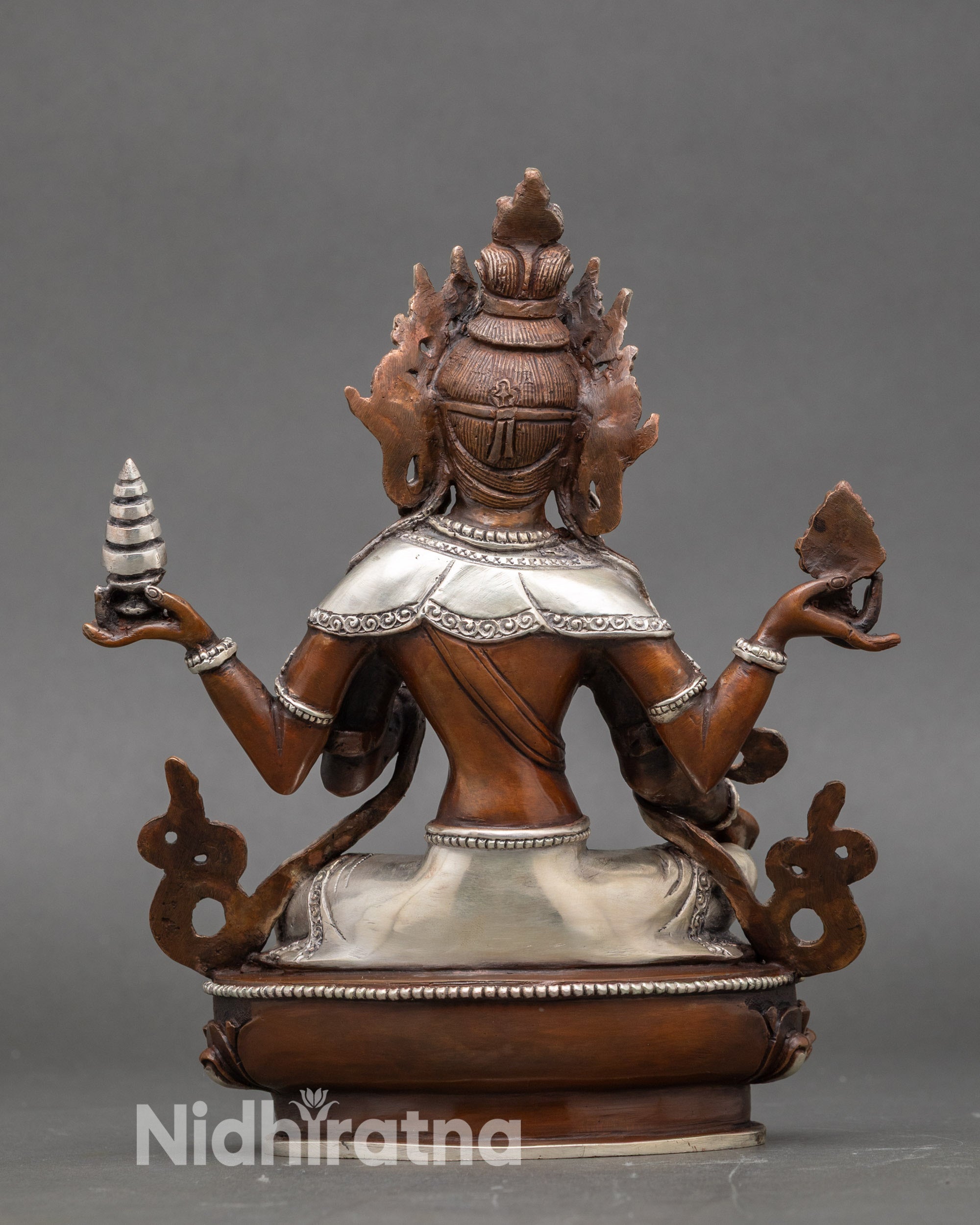 Back view of Nepalese Laxmi Statue, detailed lotus seat and sacred silver-plated finish