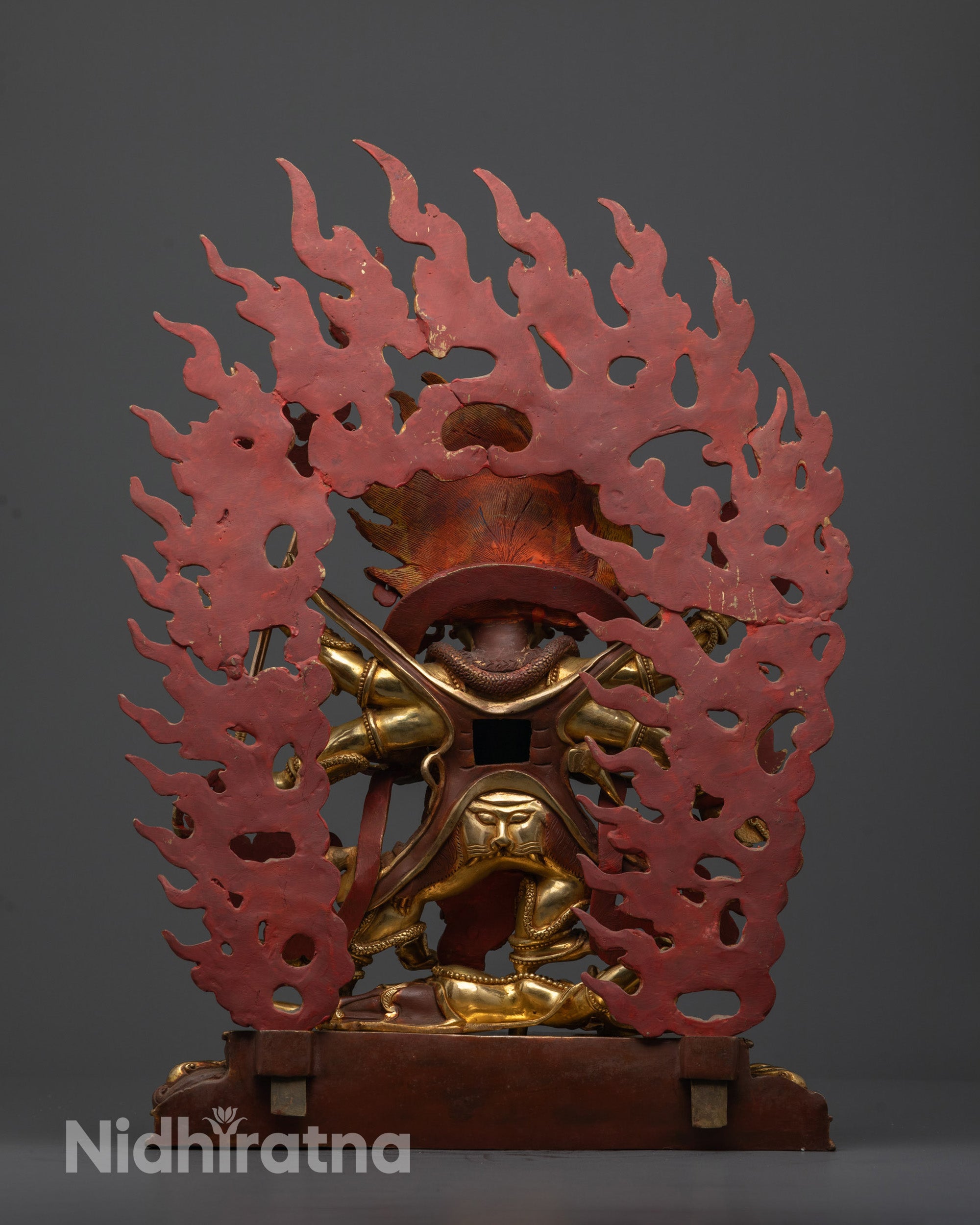 Back view of Nepalese Mahakala Statue highlighting throne and snake motifts