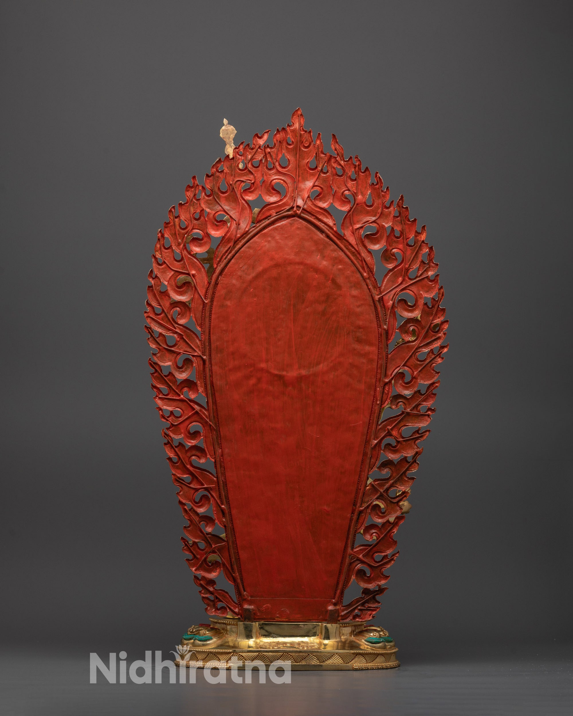 Back view of Nepalese Troma Nagmo statue showing gold gilded copper body and halo design