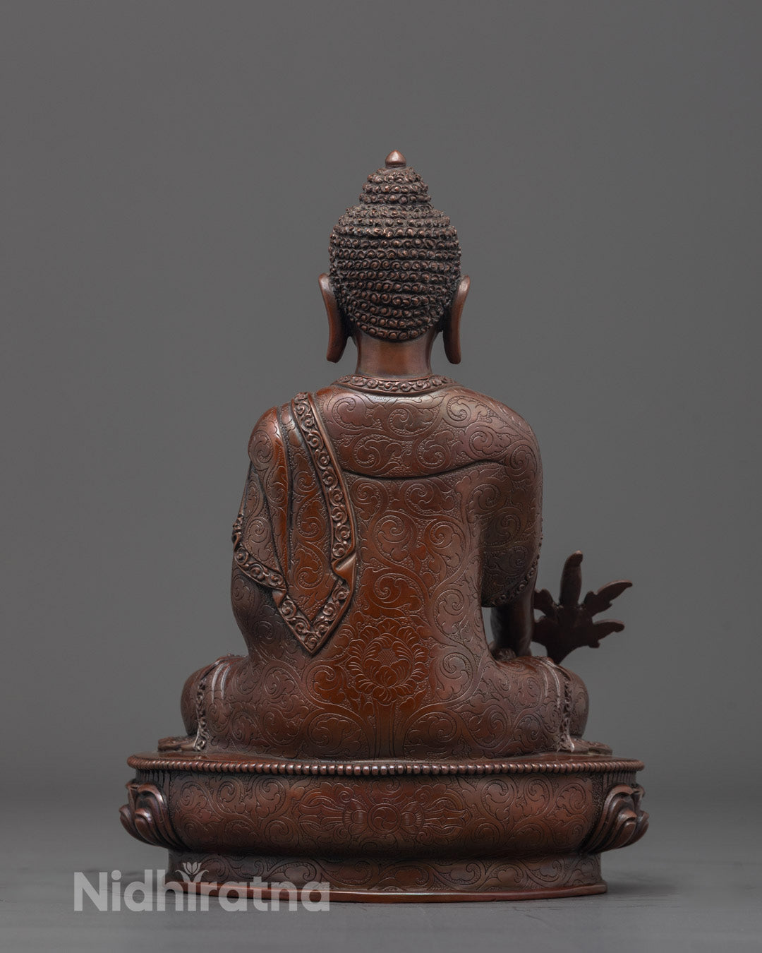 Back view of Oxidized Medicine Buddha Statue showing detailed monk’s robe craftsmanship
