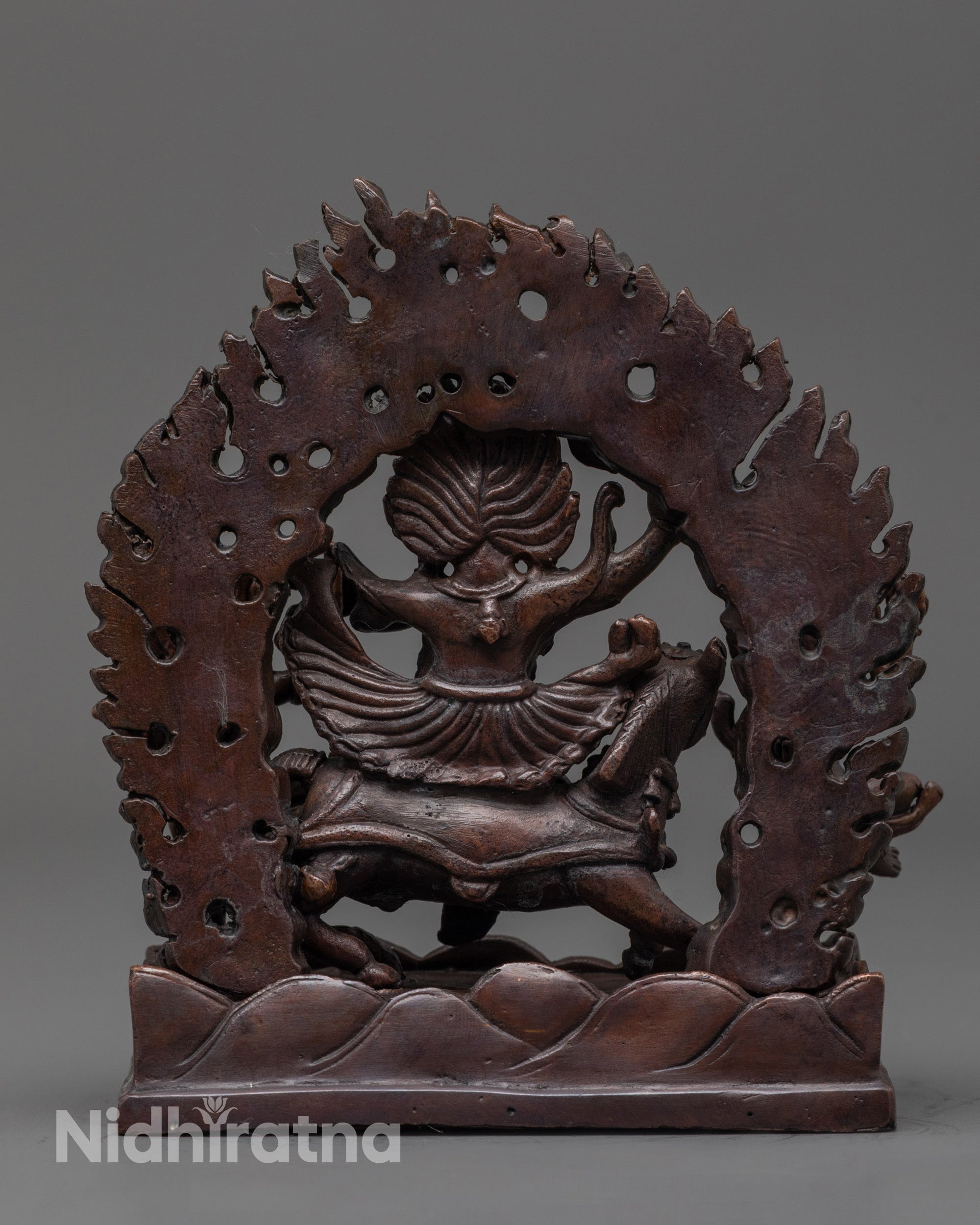 Back view of Palden Lhamo statue showing flowing robes and detailed oxidized copper finish