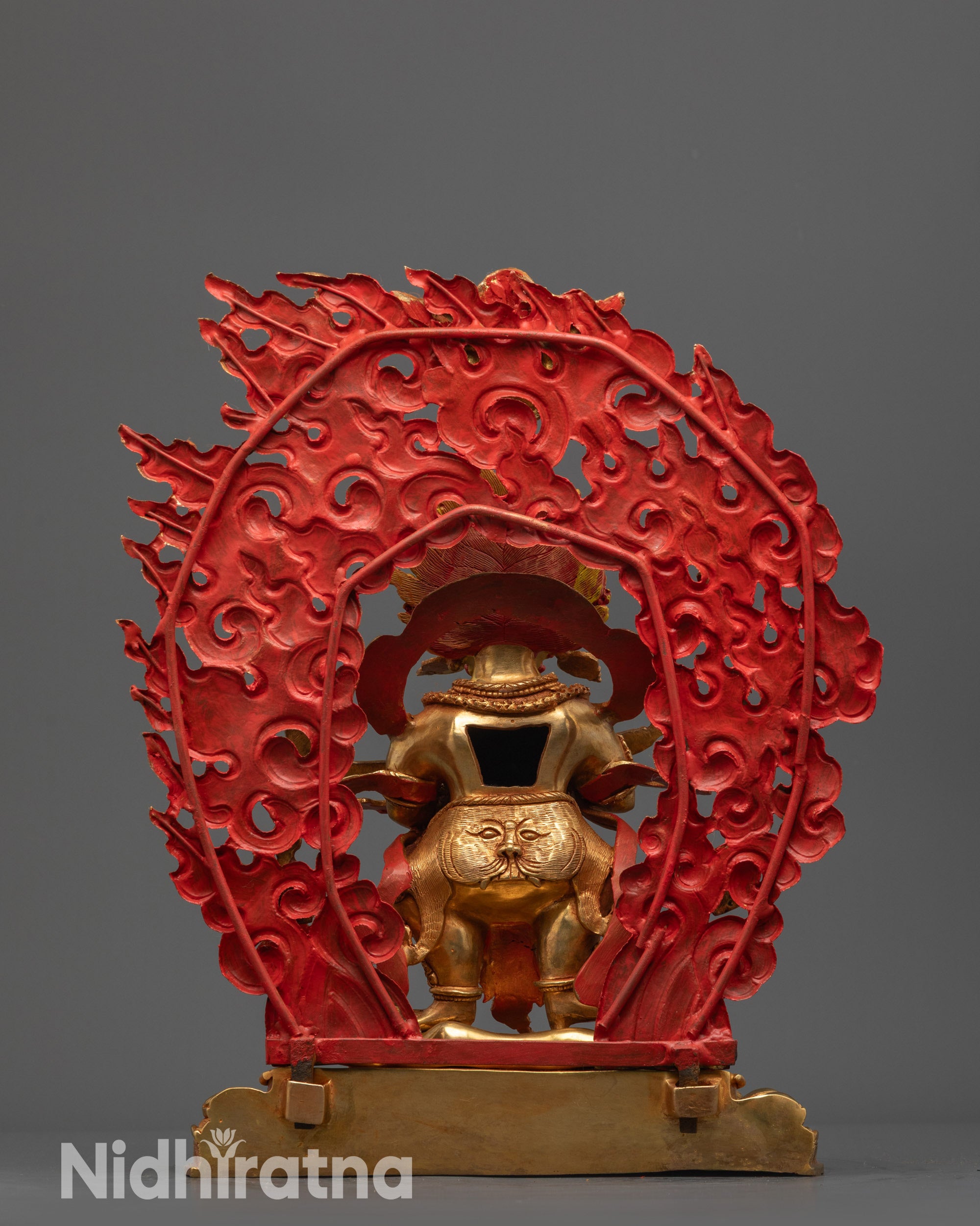 Back view of Sakya Mahakala Statue featuring carved halo with small deities and miniature Garuda
