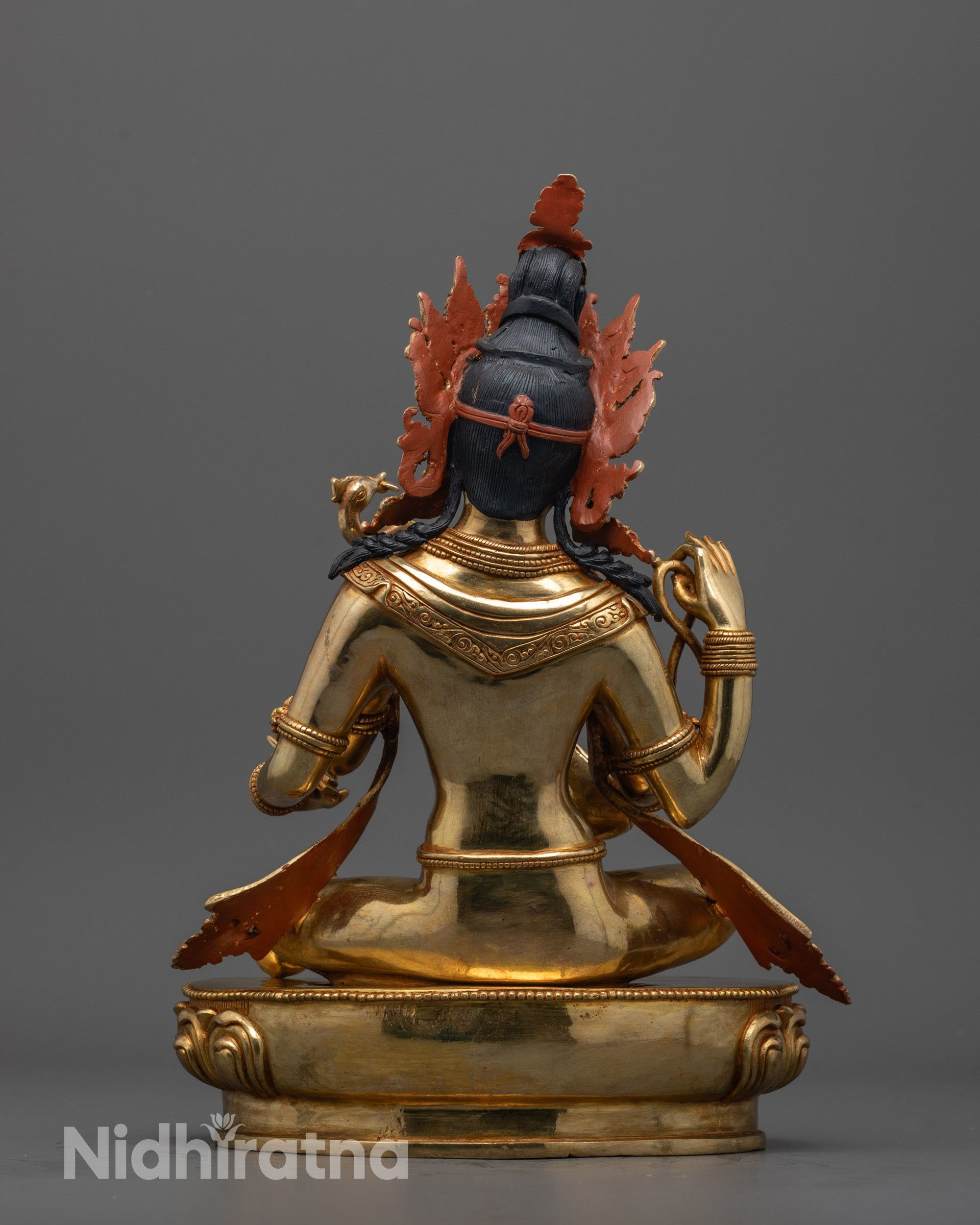 Back view of Saraswati Maa statue highlighting detailed craftsmanship and gold fire-gilded body.