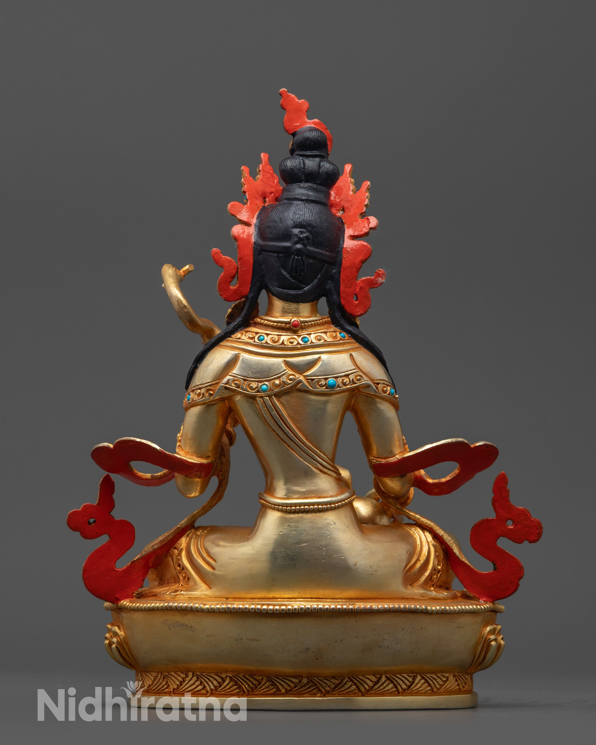 Back view of Saraswati Statue showing gold fire-gilded body and exquisite carving details