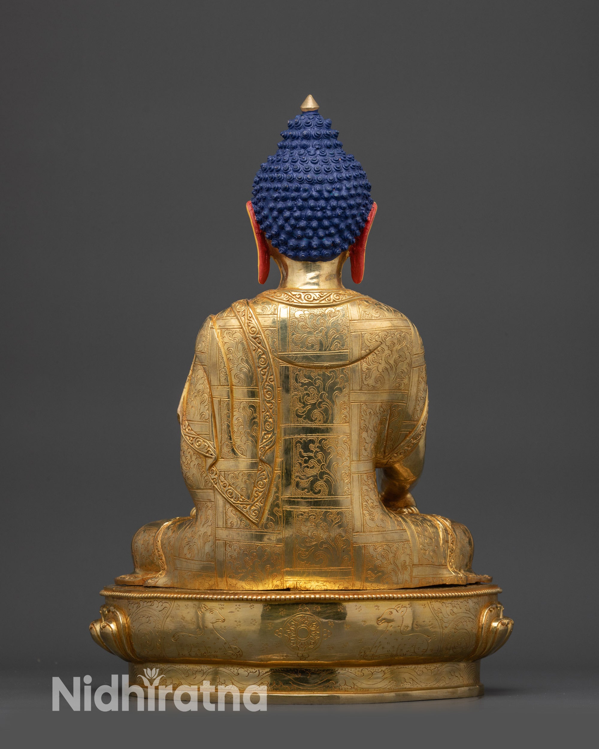 Back view of Seated Shakyamuni Buddha showing intricate robe patterns
