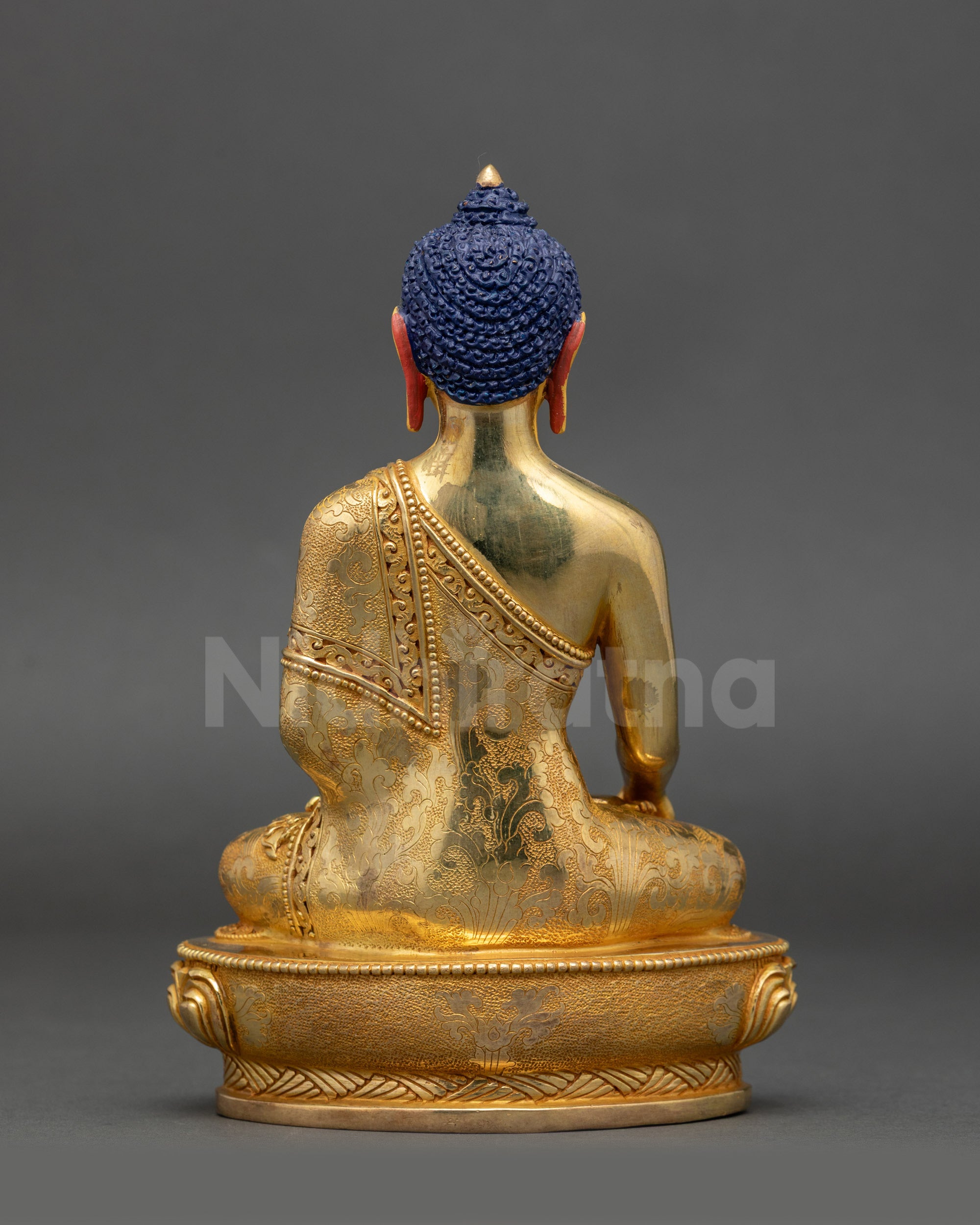 Back view of Shakyamuni Buddha Sculpture highlighting detailed robe carvings