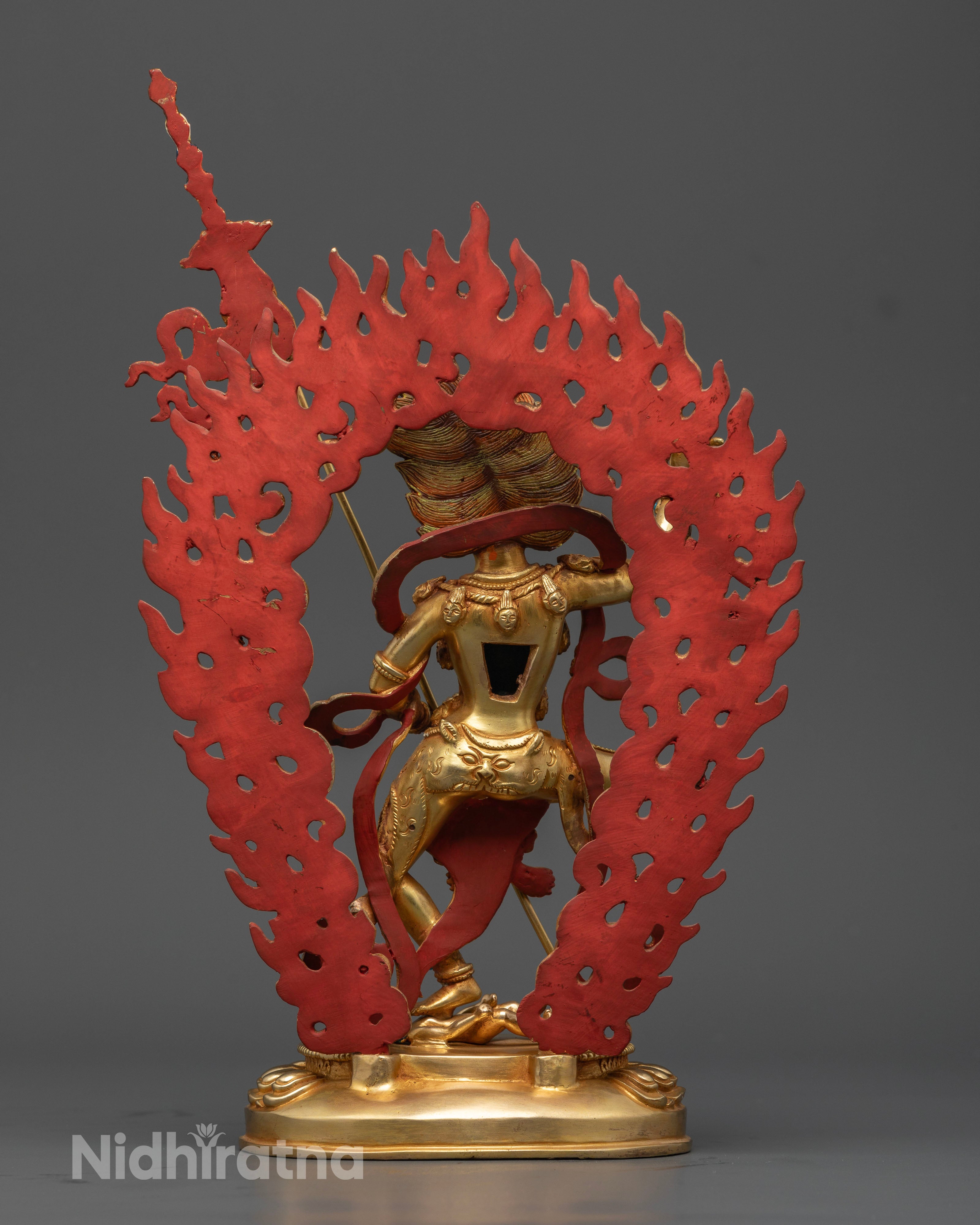 Back view of Simhamukha Statue highlighting intricate gold-coated copper craftsmanship