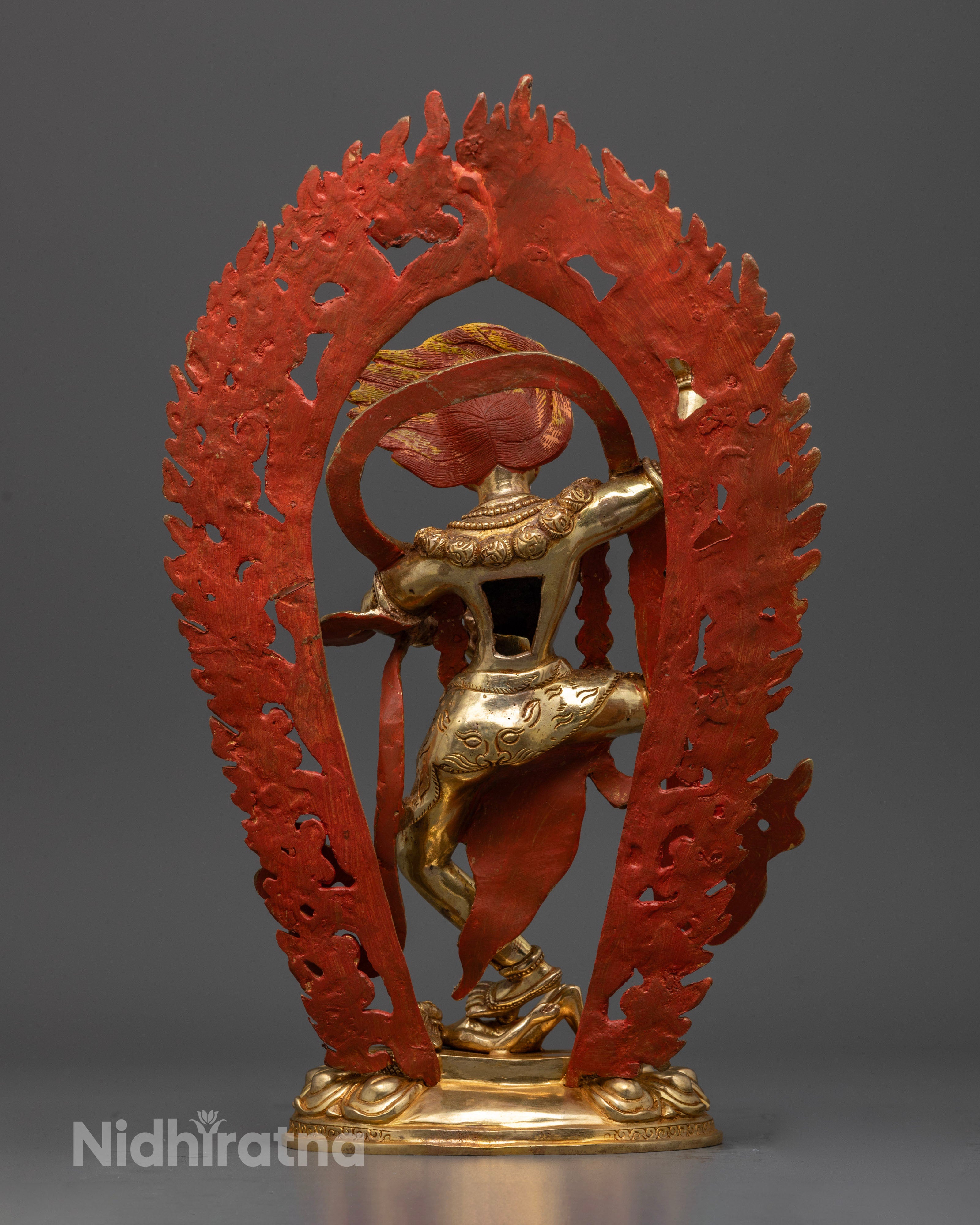 Back view of Simhamukha statue highlighting detailed fire backdrop and artisan work