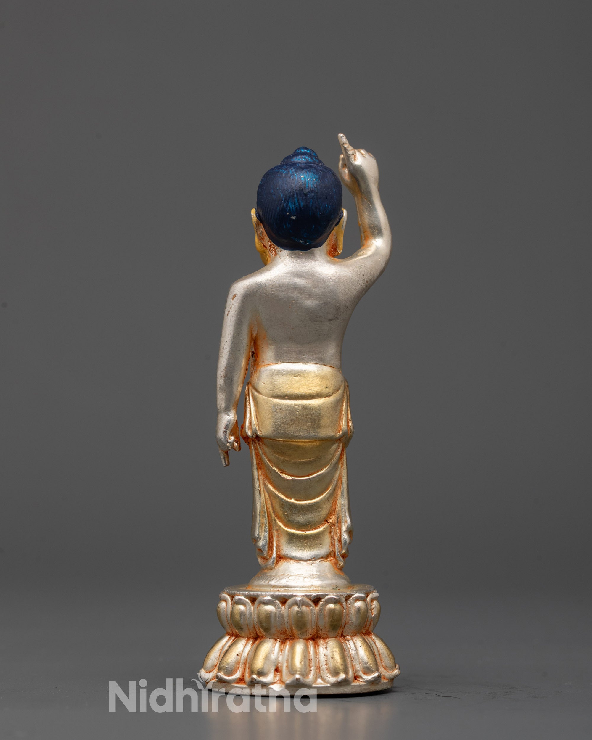 Back view of Spiritual Little Buddha sculpture with gold-gilded face symbolizing peace