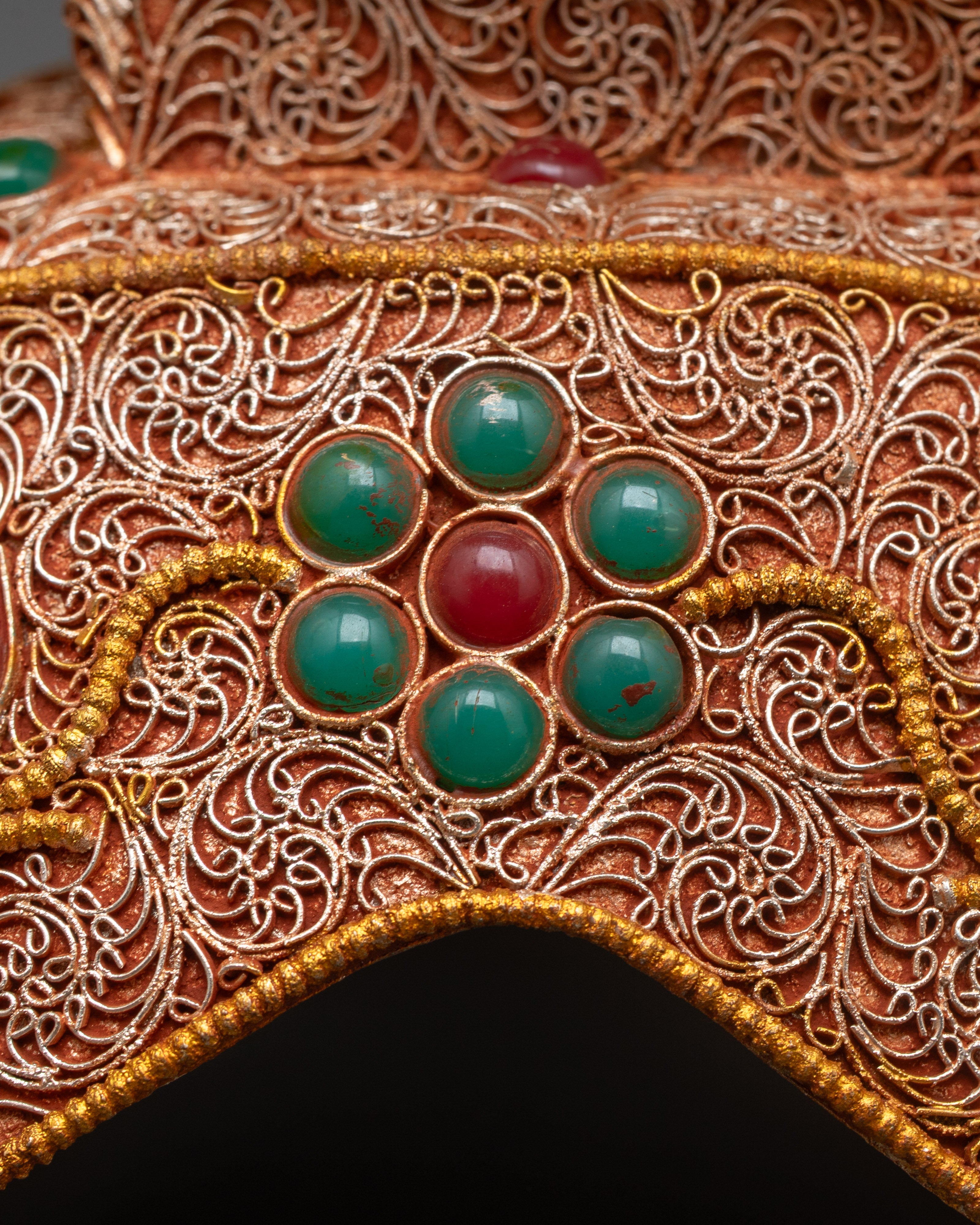 Back view of Tibetan Skull Cup Set highlighting silver-plated finish and three-sided base