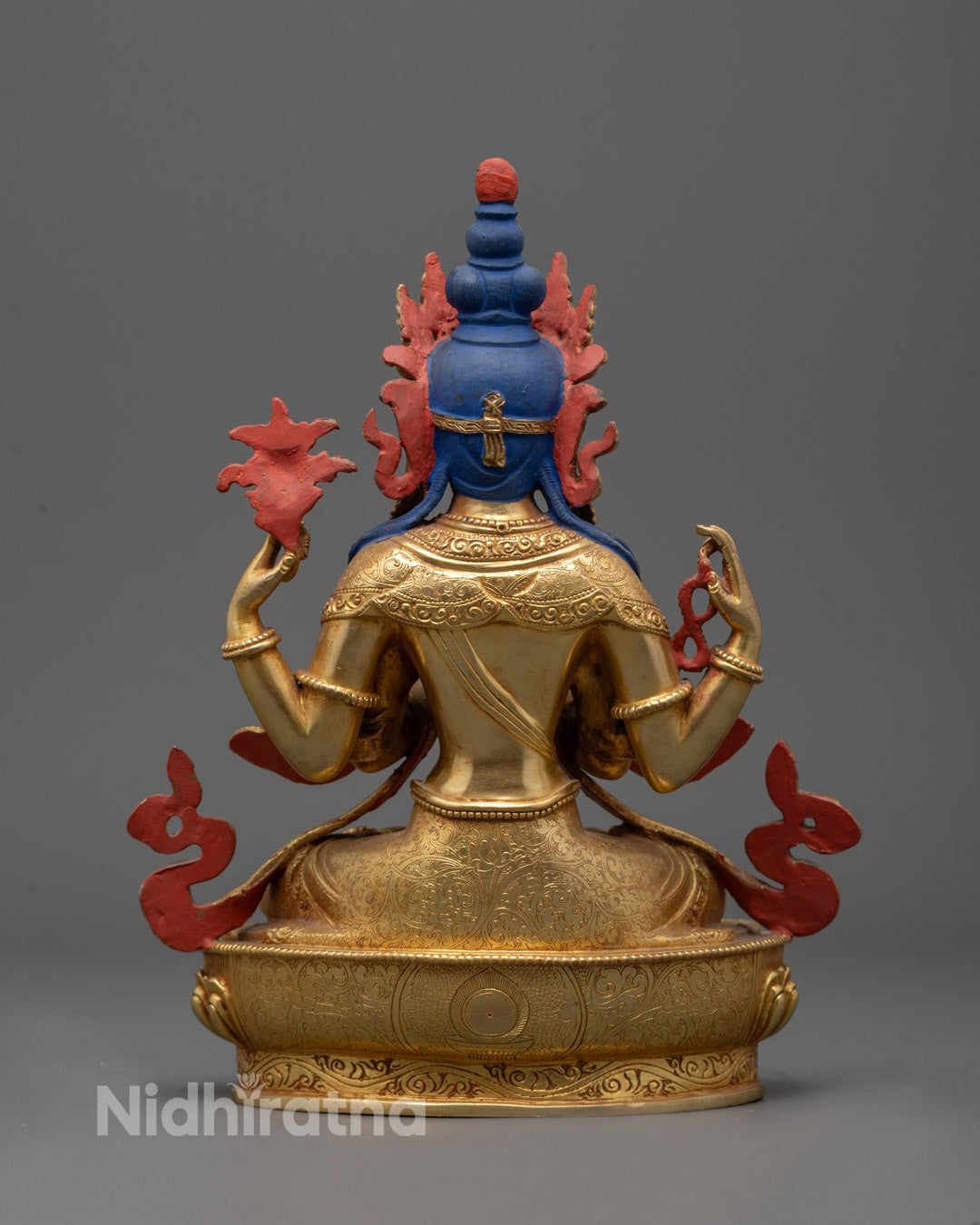 Back view of Traditional Tibetan Chenrezig statue with silver and gold plating