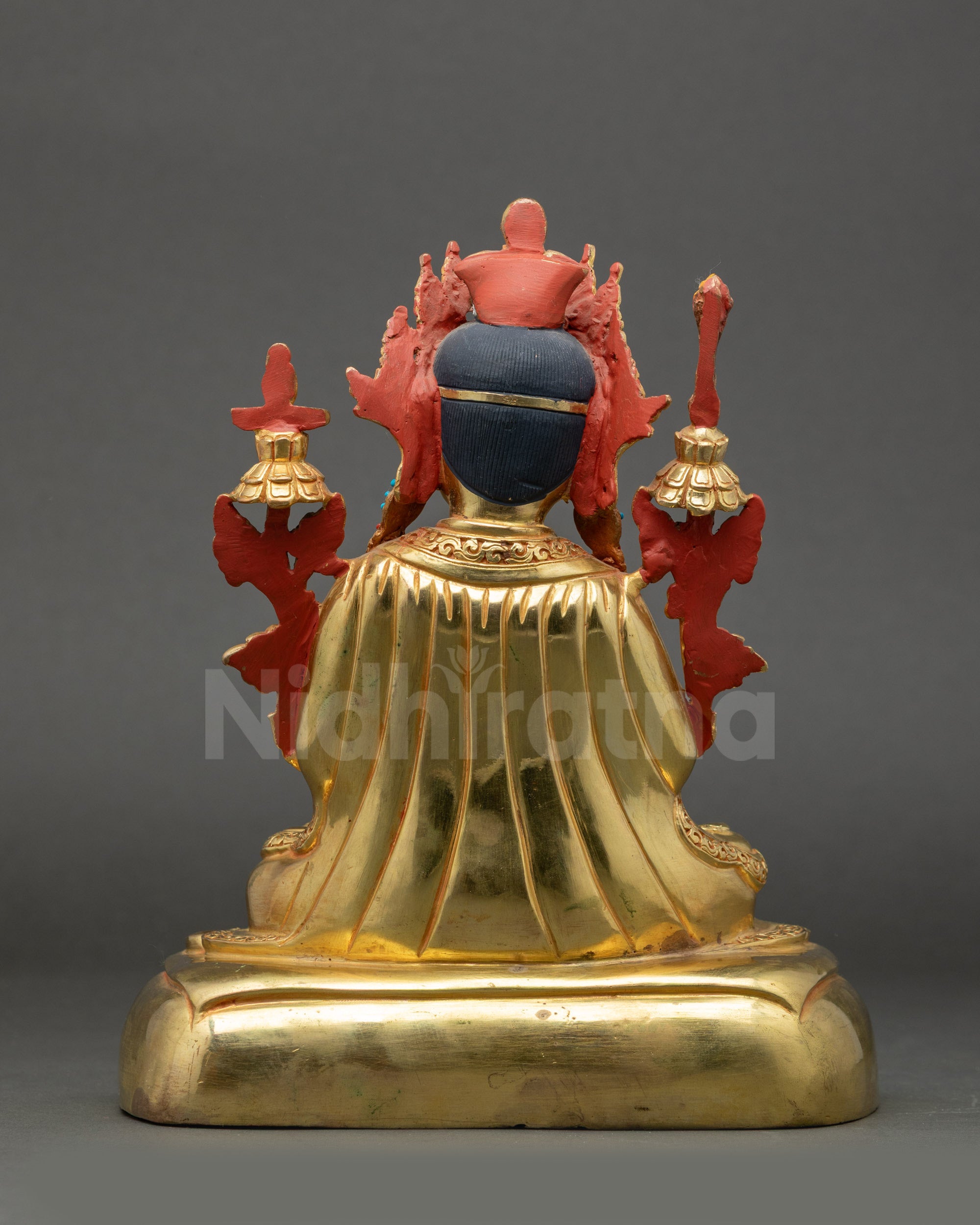 Back view of Trisong Detsen Statue showing flowing robes and intricate details