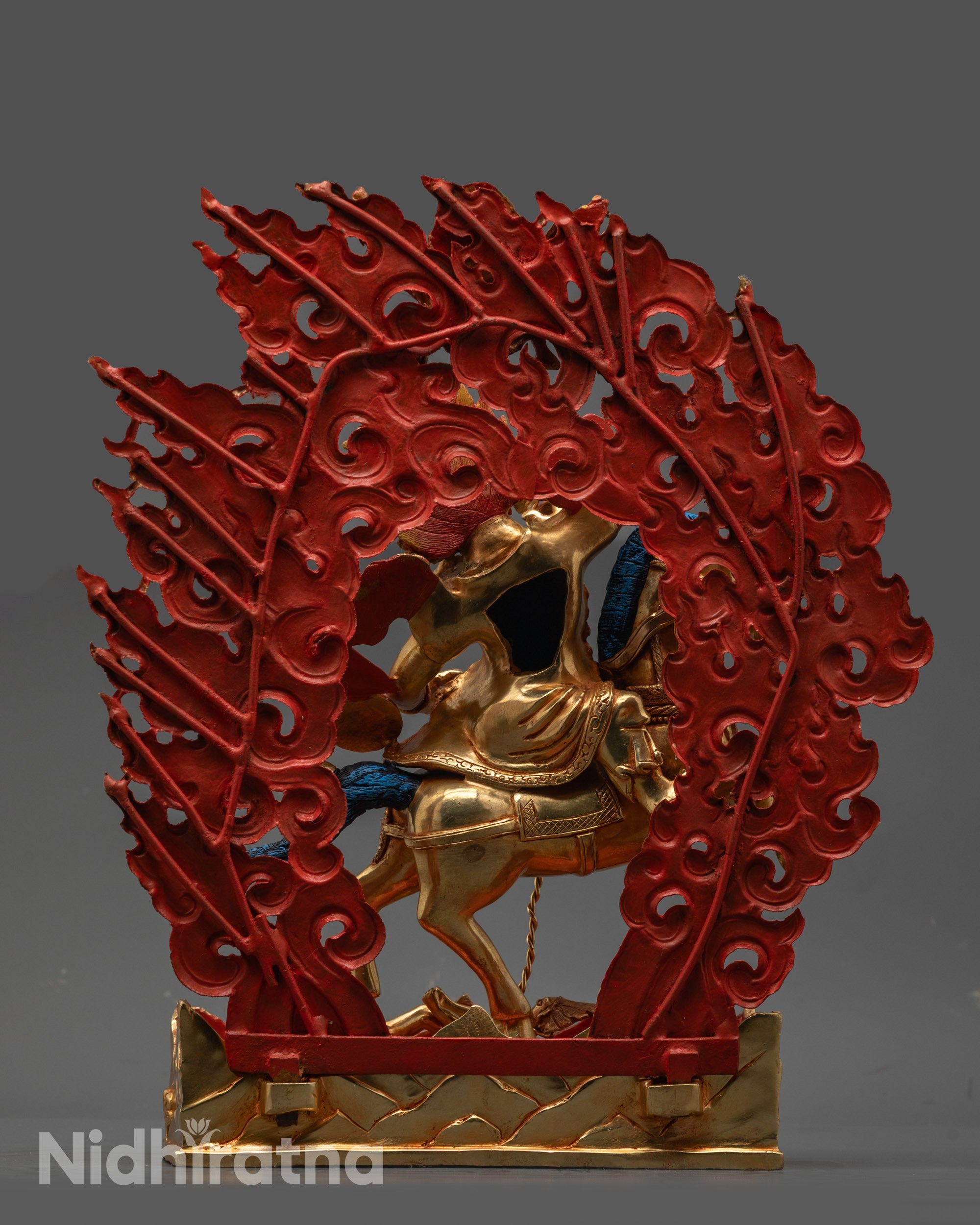 Back view of Tsengo Rolpa Chudan Statue highlighting detailed carvings and halo design