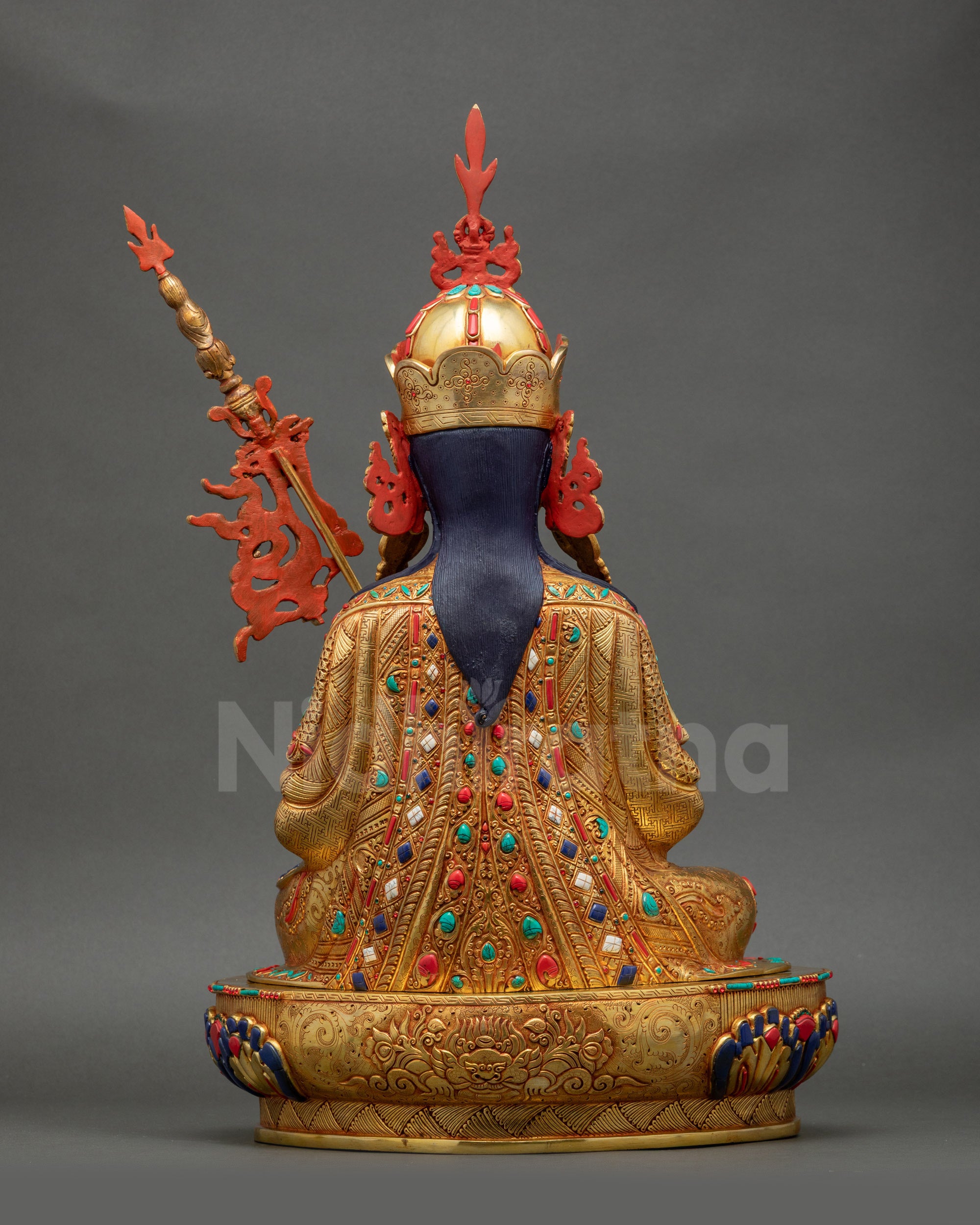 Back view of Tsokye Dorje Statue highlighting engraved Garuda symbol and lotus throne