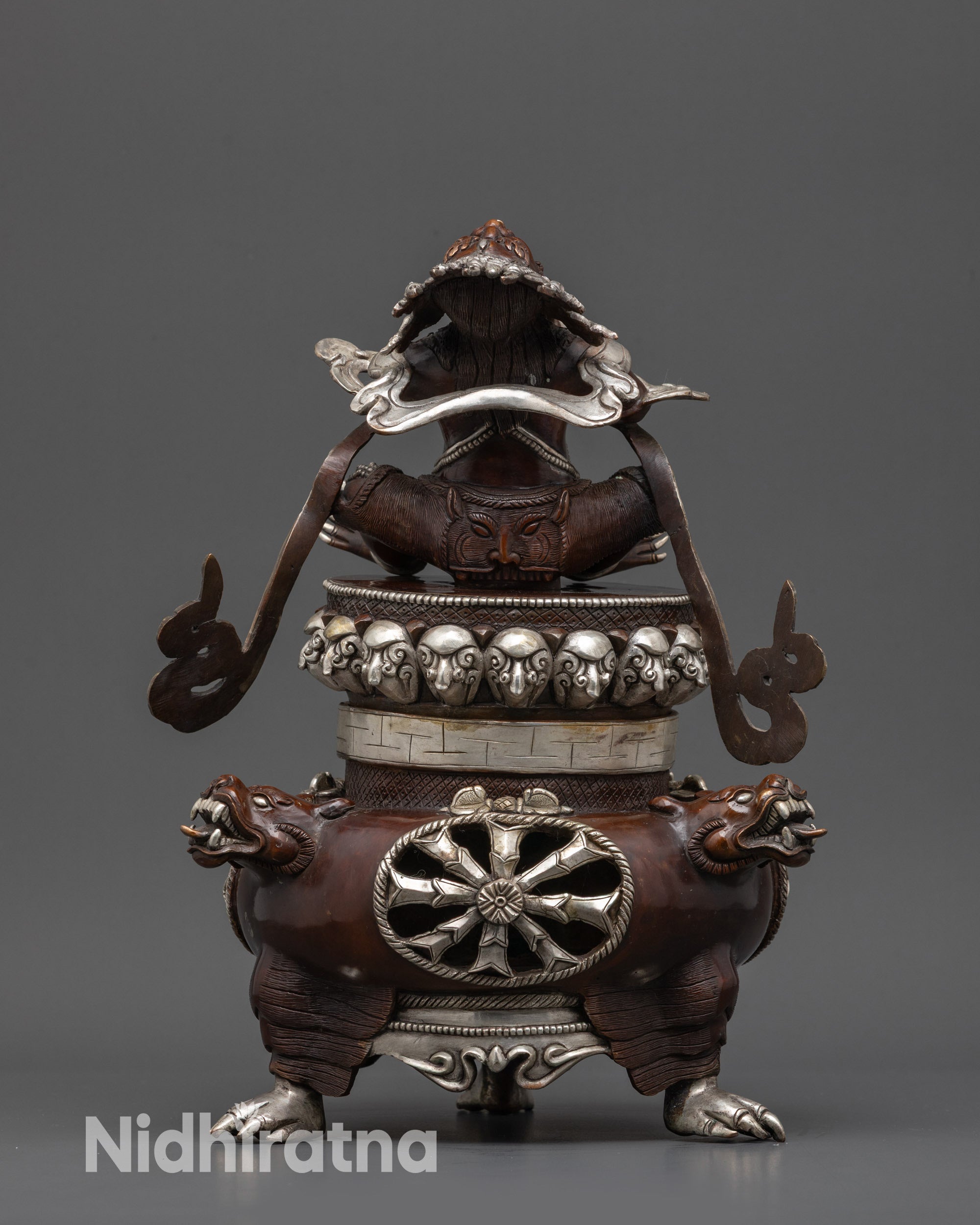 Back view of Vajradhaka Statue highlighting silver-plated oxidized finish