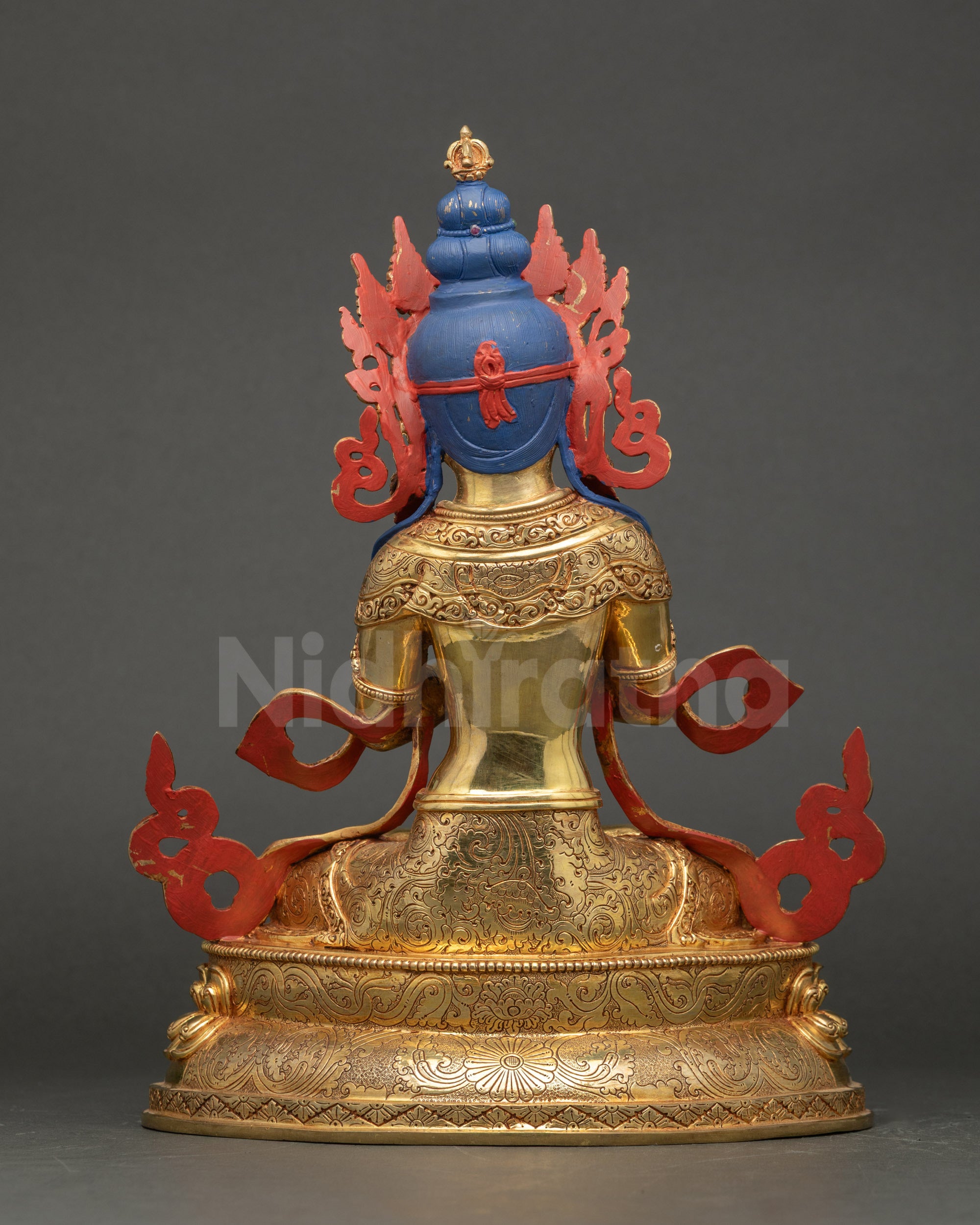 Back view of Vajradhara Statue displaying carved robes and intricate lotus base patterns