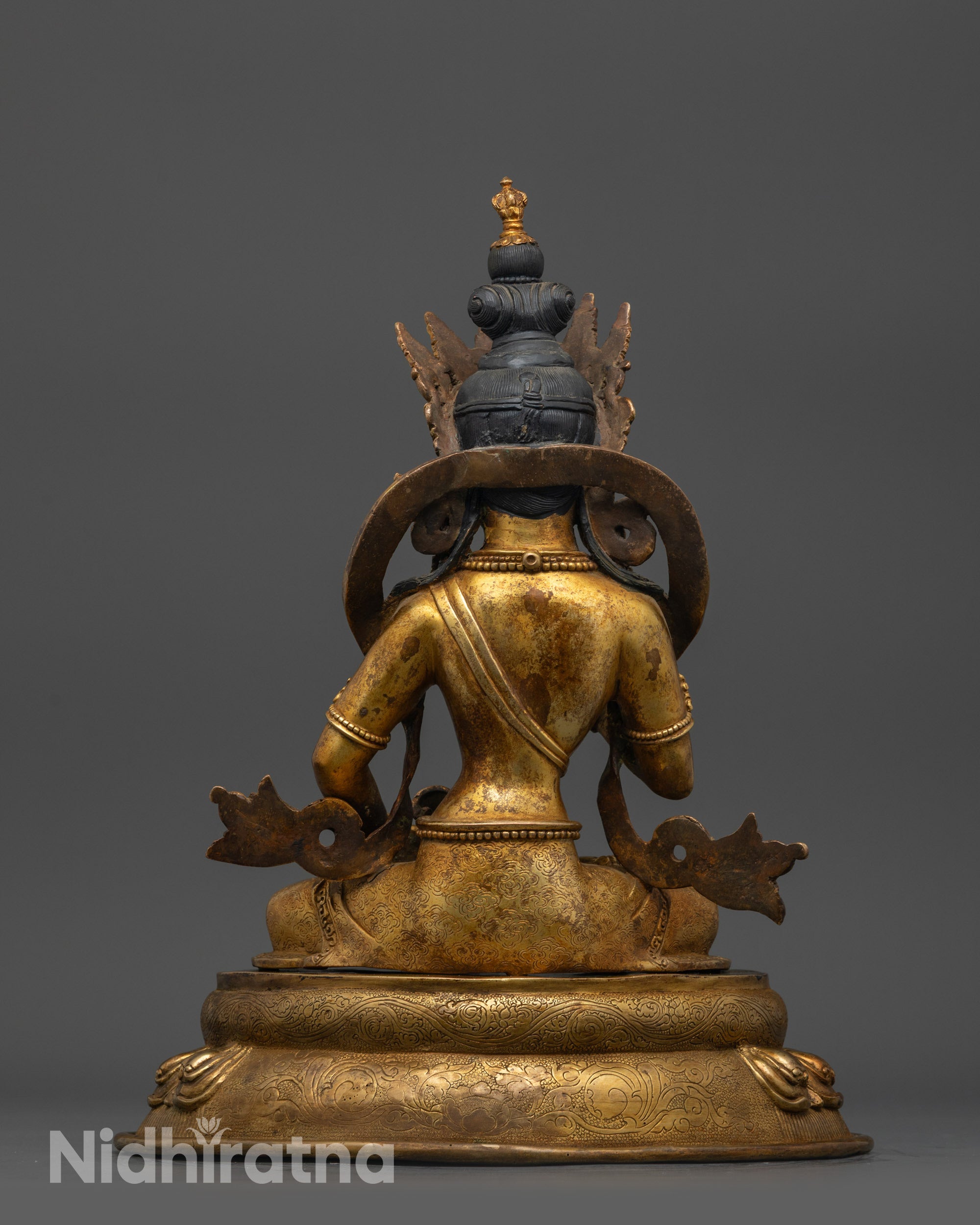Back view of Vajrasattva Sculpture showing detailed lotus seat and robe carvings