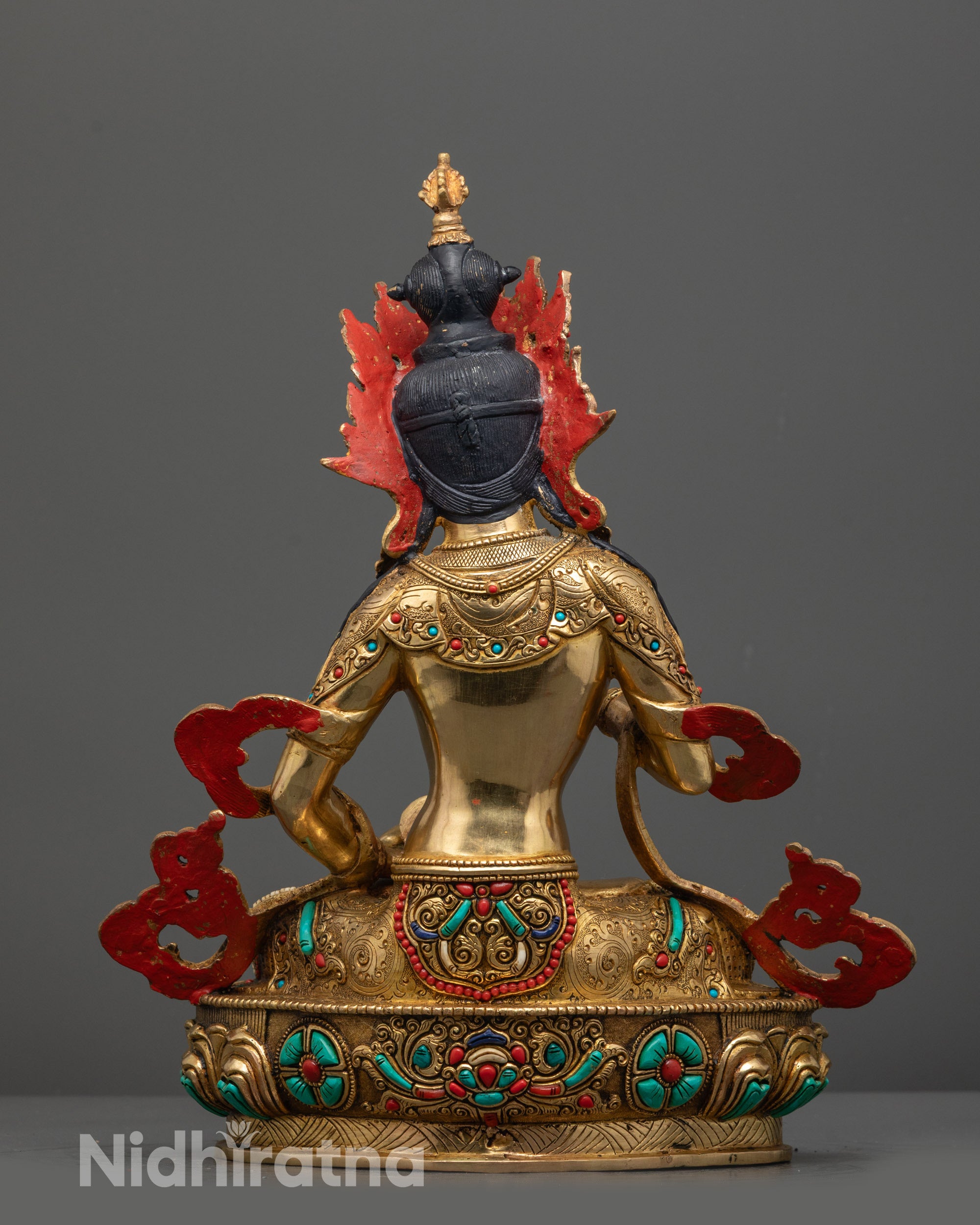 Back view of Vajrasattva Statue highlighting patterned jewelry and detailed lotus seat