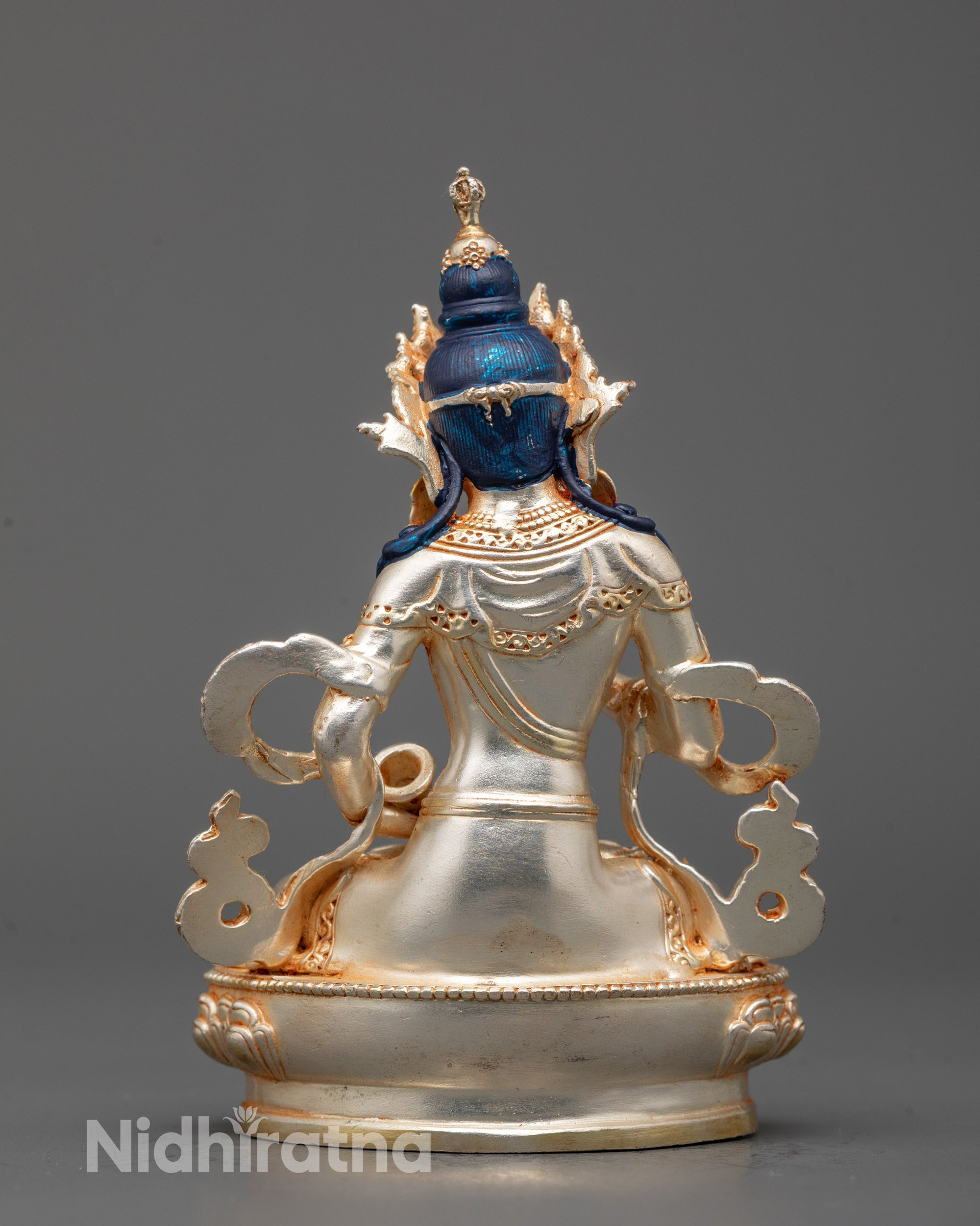 Back view of Vajrasattva Statue showing detailed ornaments and silver lotus base