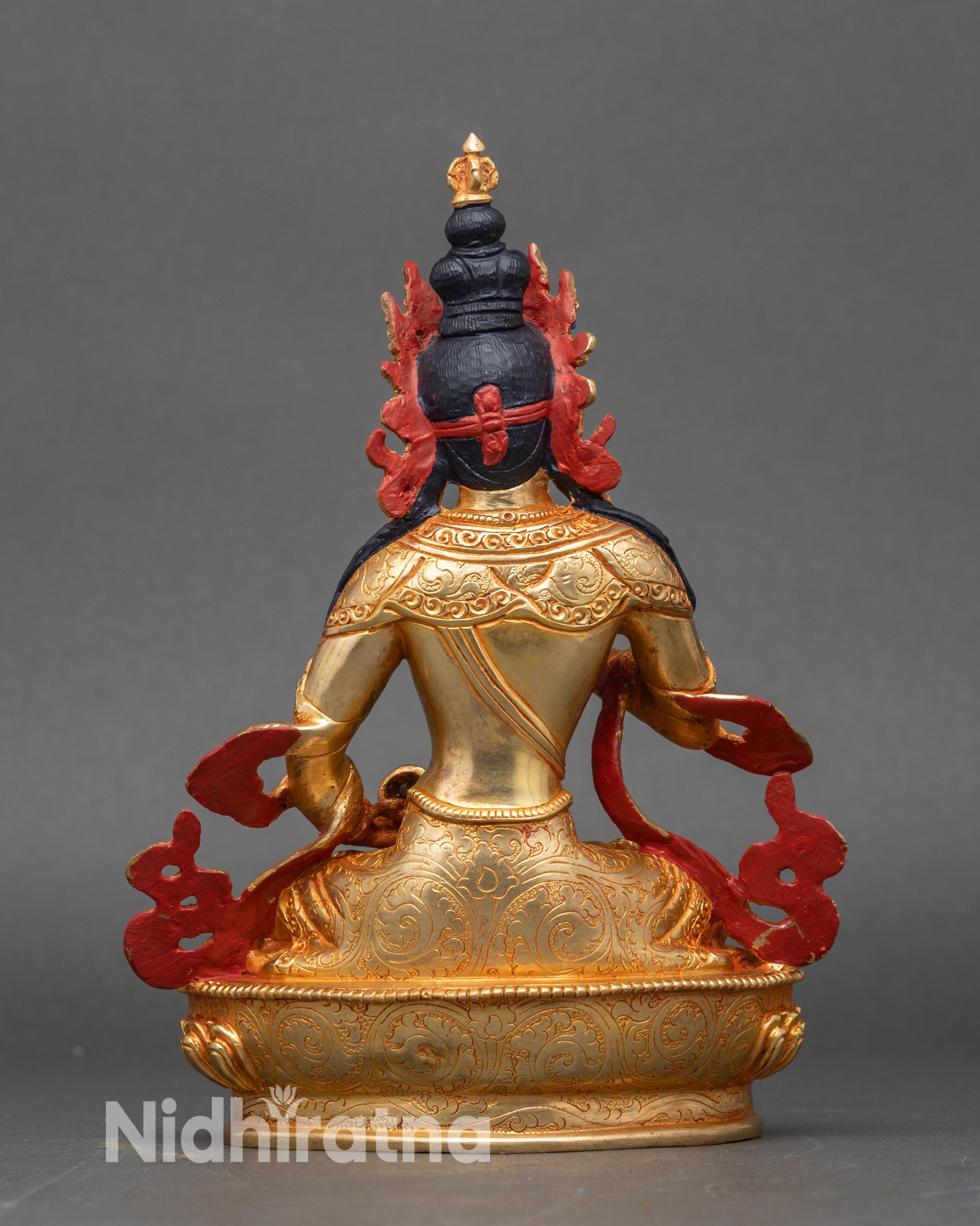 Back view of Vajrasattva statue showing lotus throne and intricate gold fire-gilding