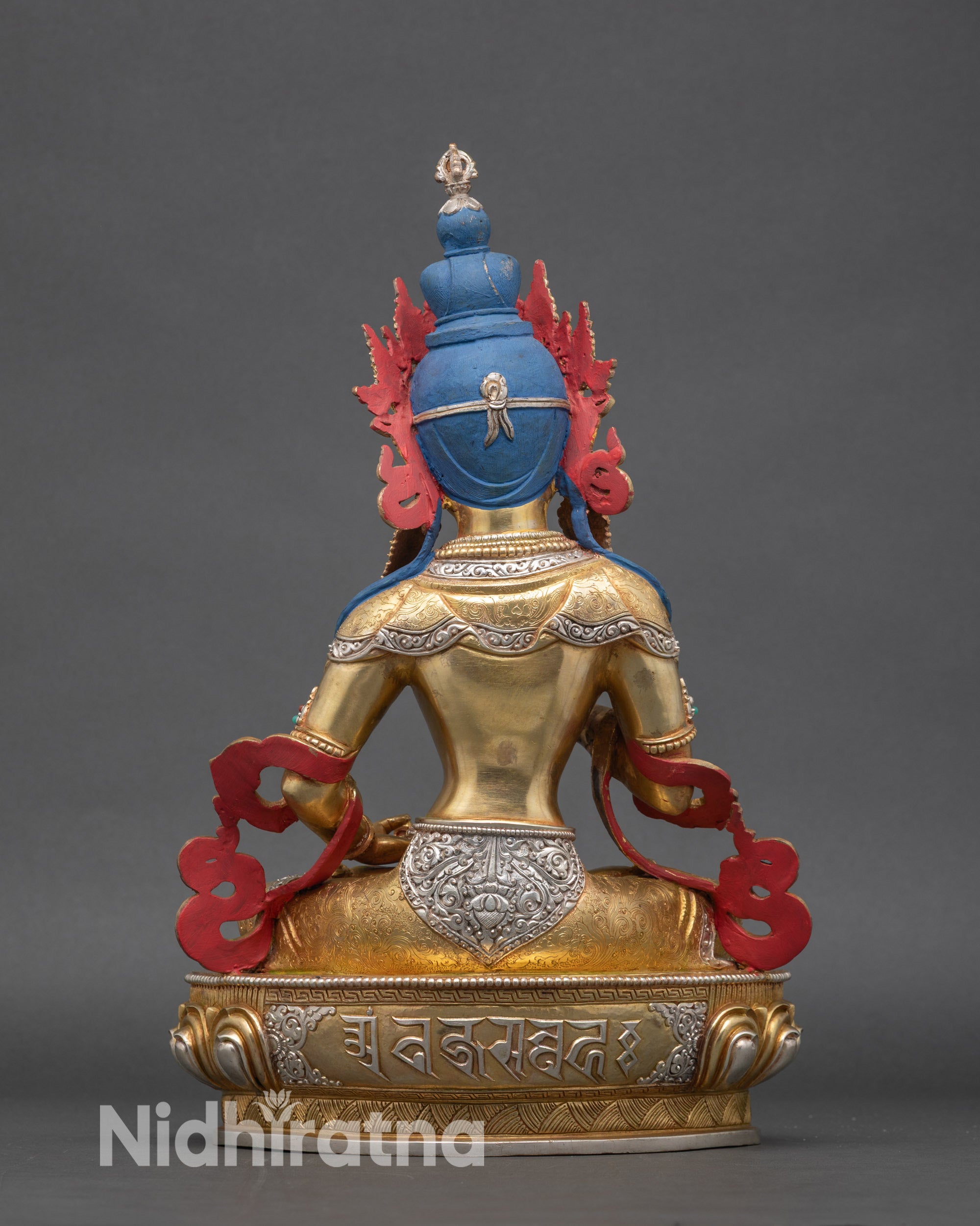 Back view of Vajrasattva statue with intricate robe carvings and finish