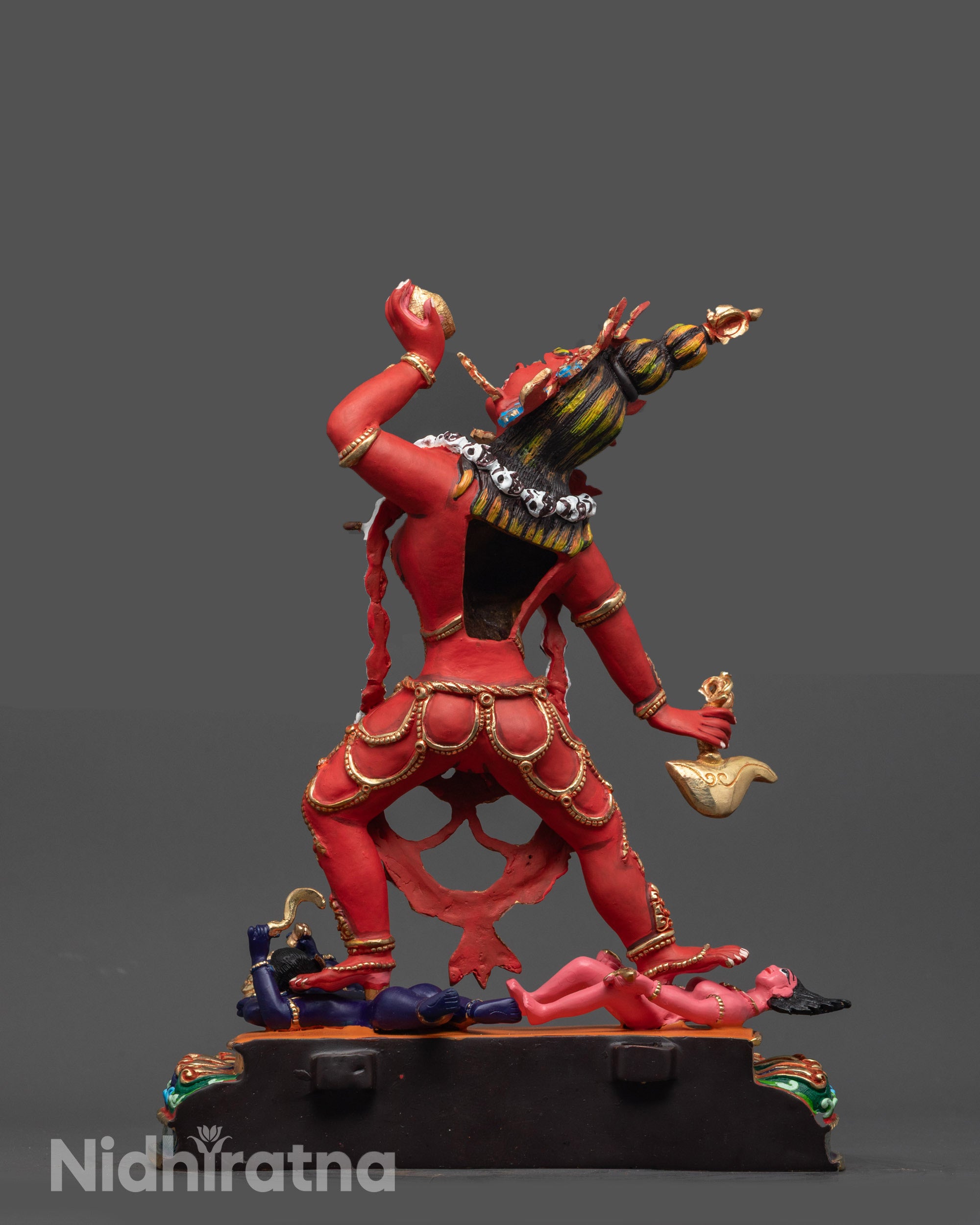 Back view of Vajrayogini statue highlighting Mundamala garland and copper base