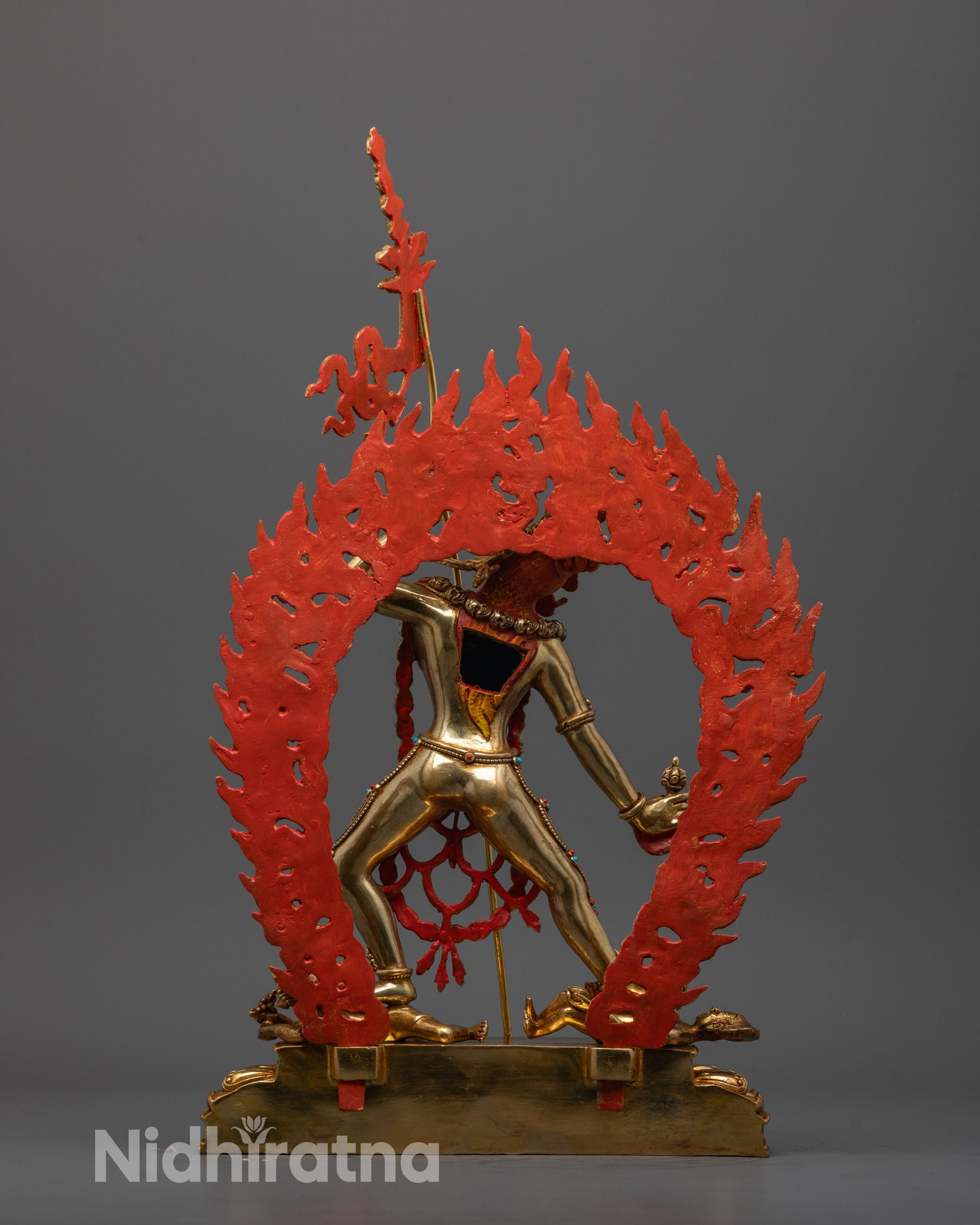 Back view of Vajrayogini statue highlighting intricate throne and hand-carved details