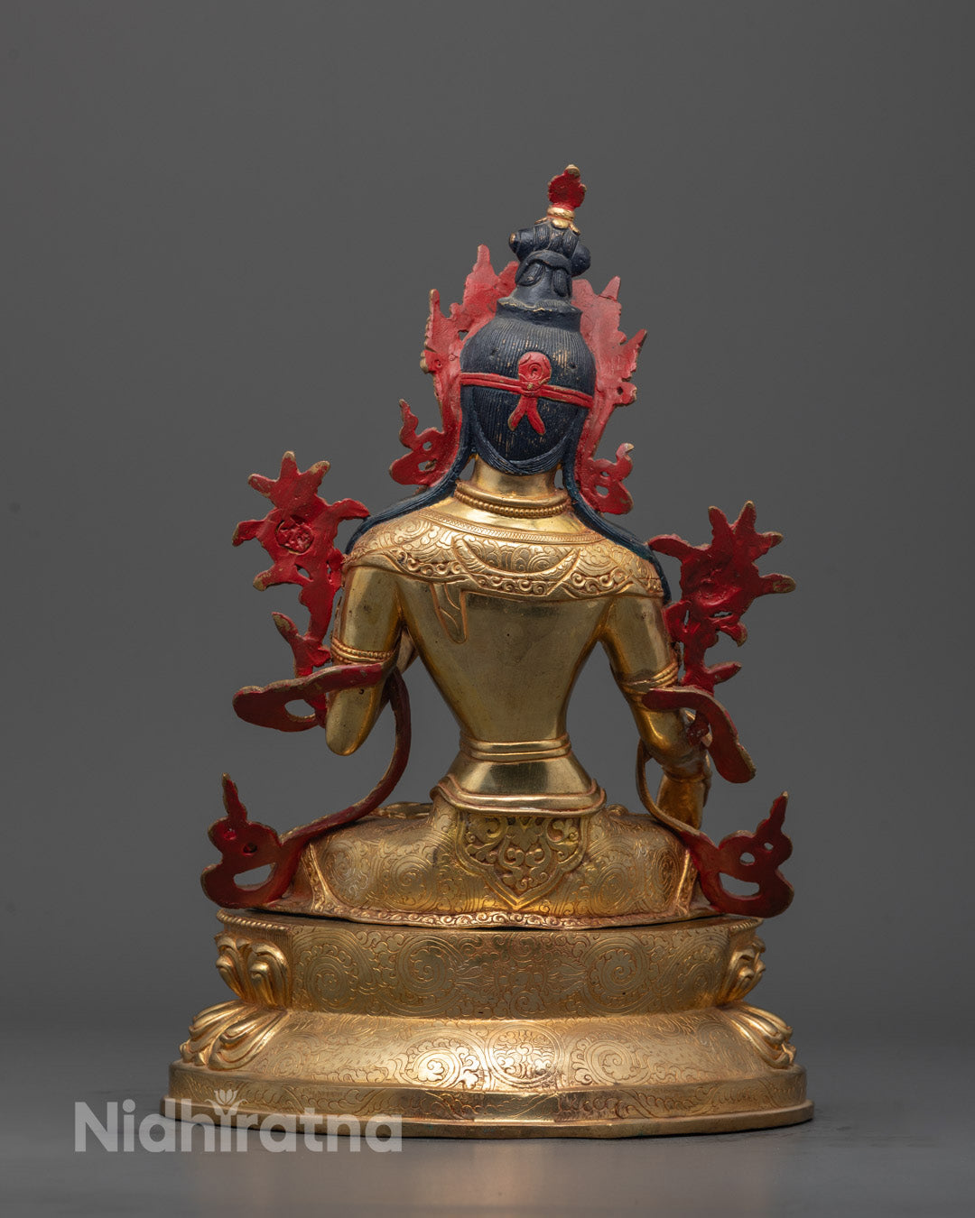 Back view of White Tara Sculpture highlighting elaborate craftsmanship and copper base