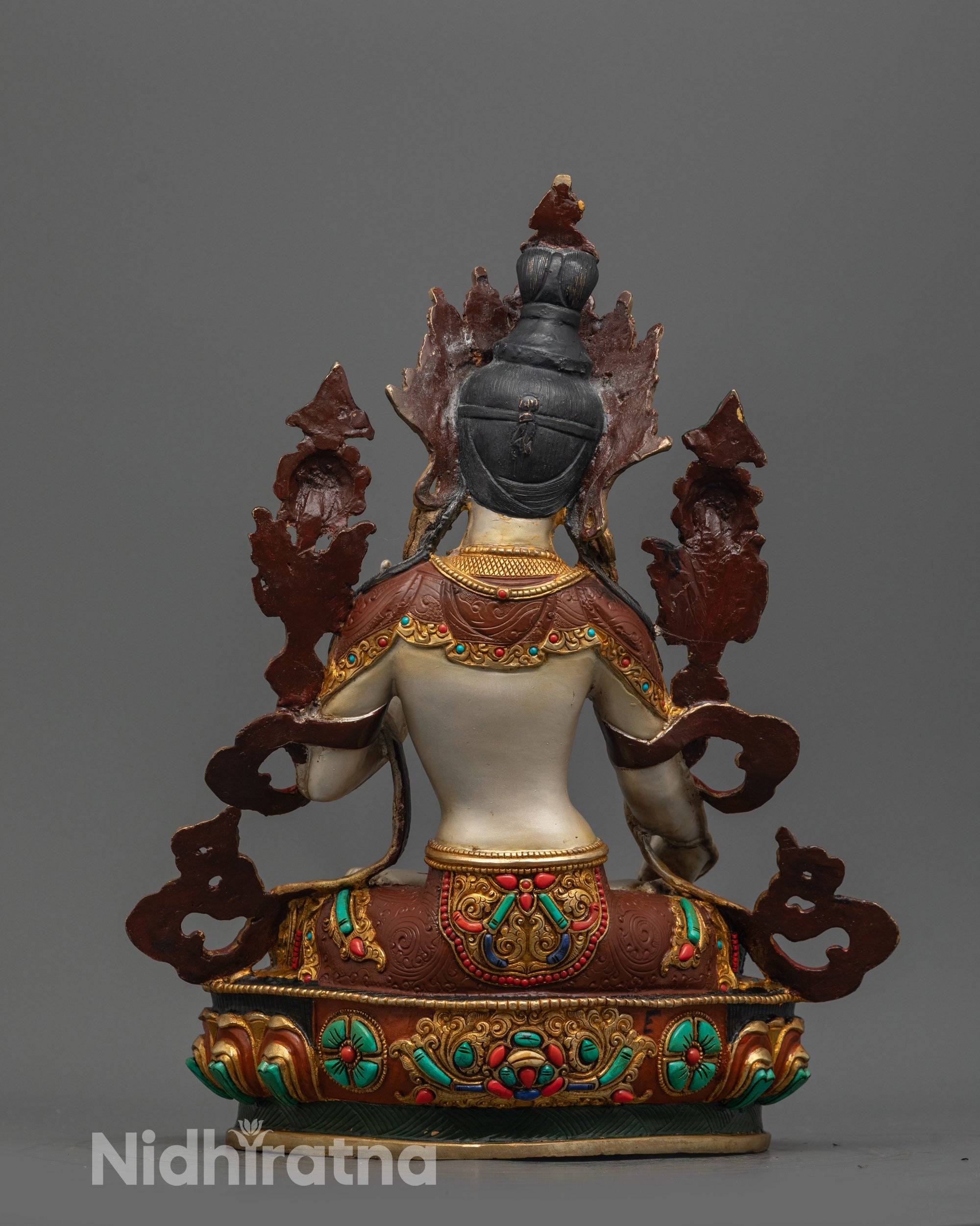 Back view of White Tara Statue showing intricate copper craftsmanship