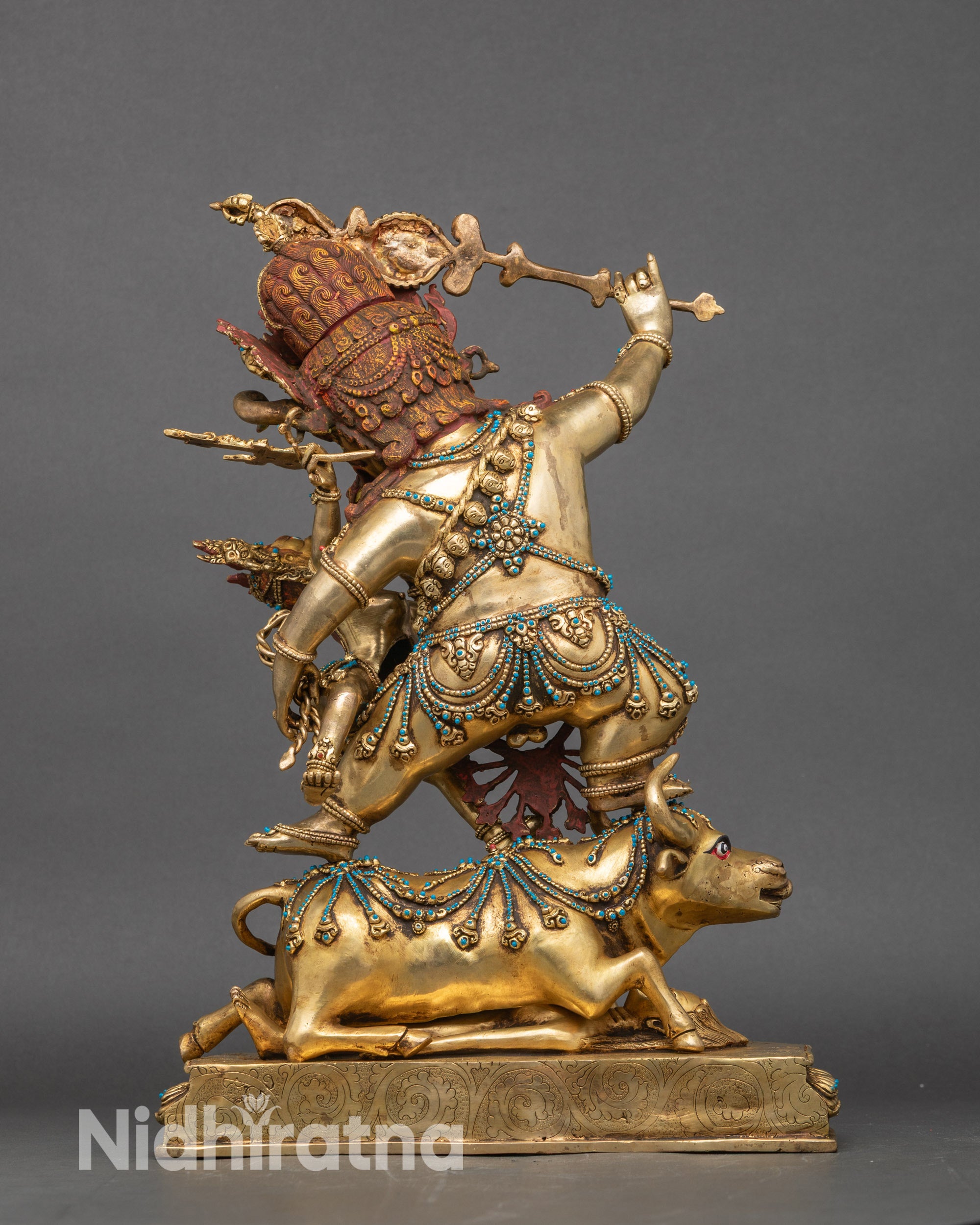 Back view of Yamantaka copper statue with intricate flame halo