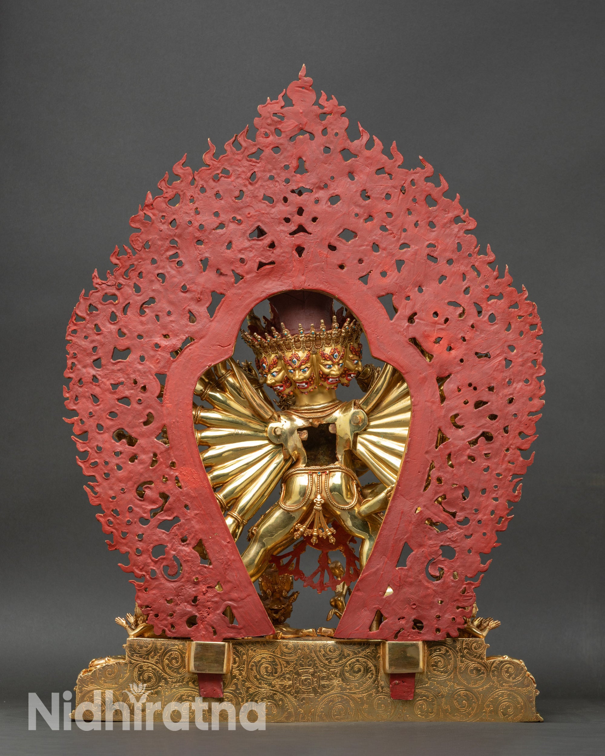 Back view of Yamantaka statue showing flaming halo and detailed sculptural work