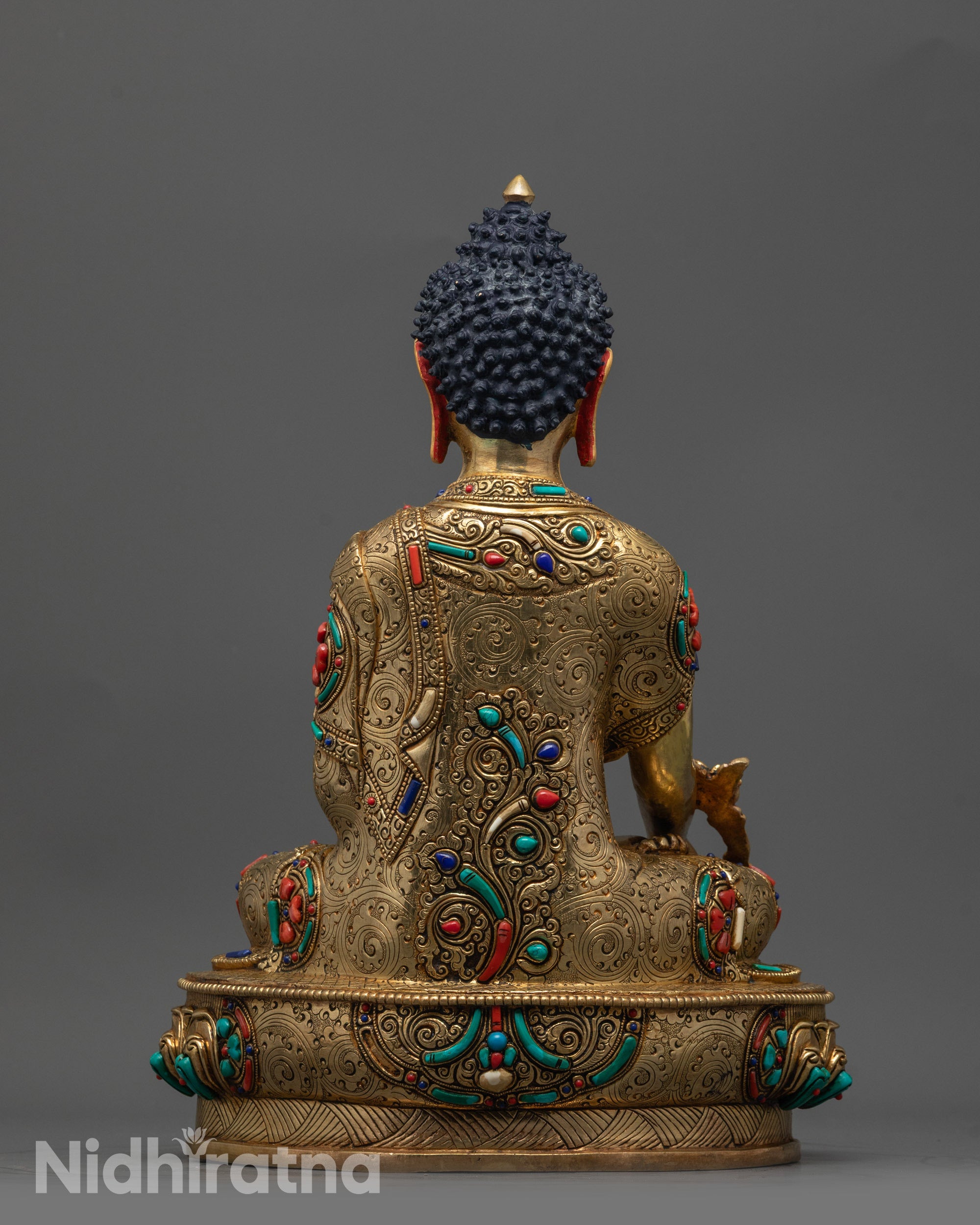 Back view of artisan-made Medicine Buddha with polished surface and masterful craftsmanship