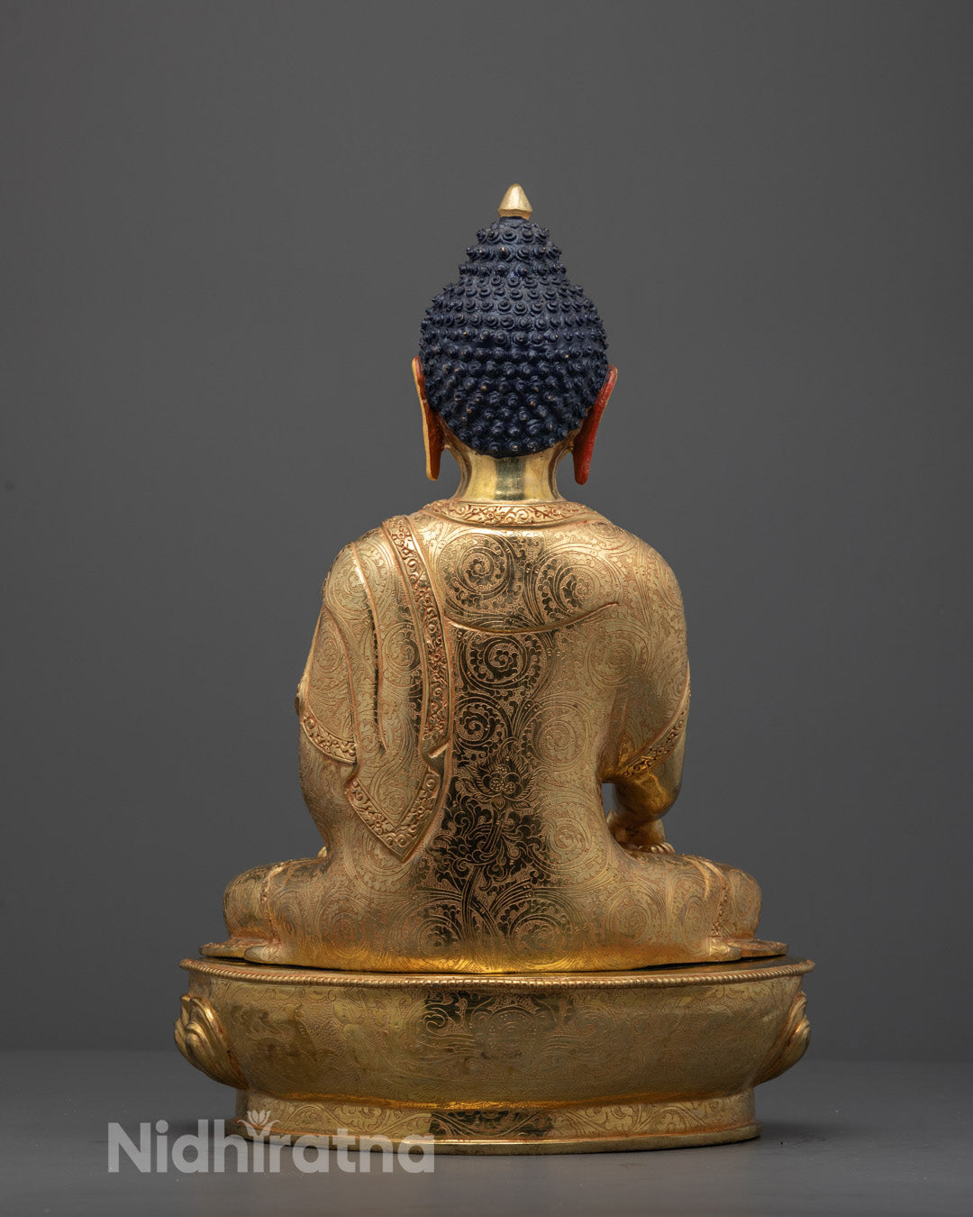 Back view of copper-based Shakyamuni Statue featuring sacred hollow chamber