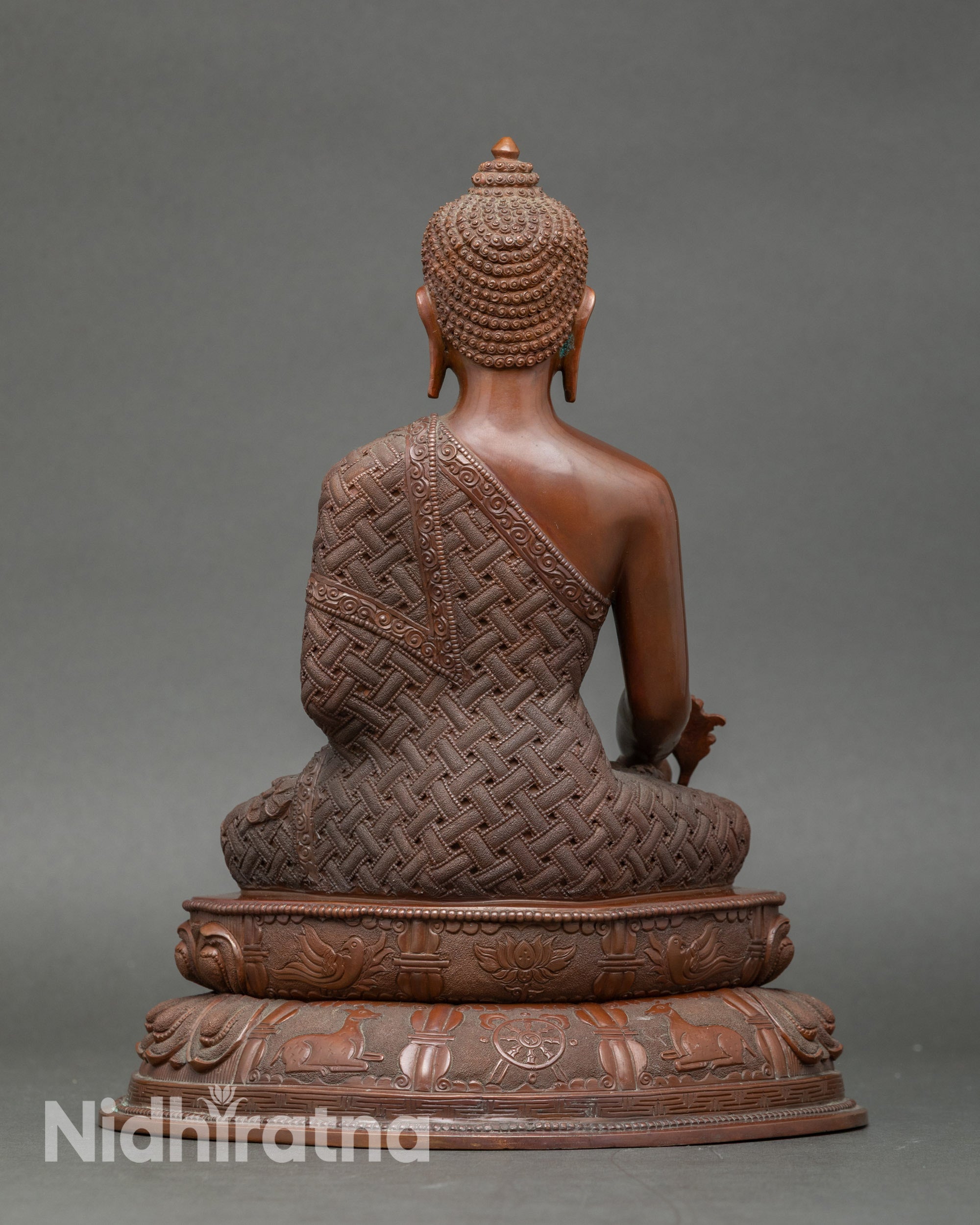 Back view of copper Healing Buddha statue, lotus seat with detailed craftsmanship