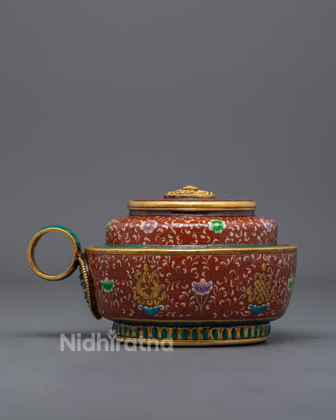 Back view of detailed copper ritual pot symbolizing purity and spiritual devotion