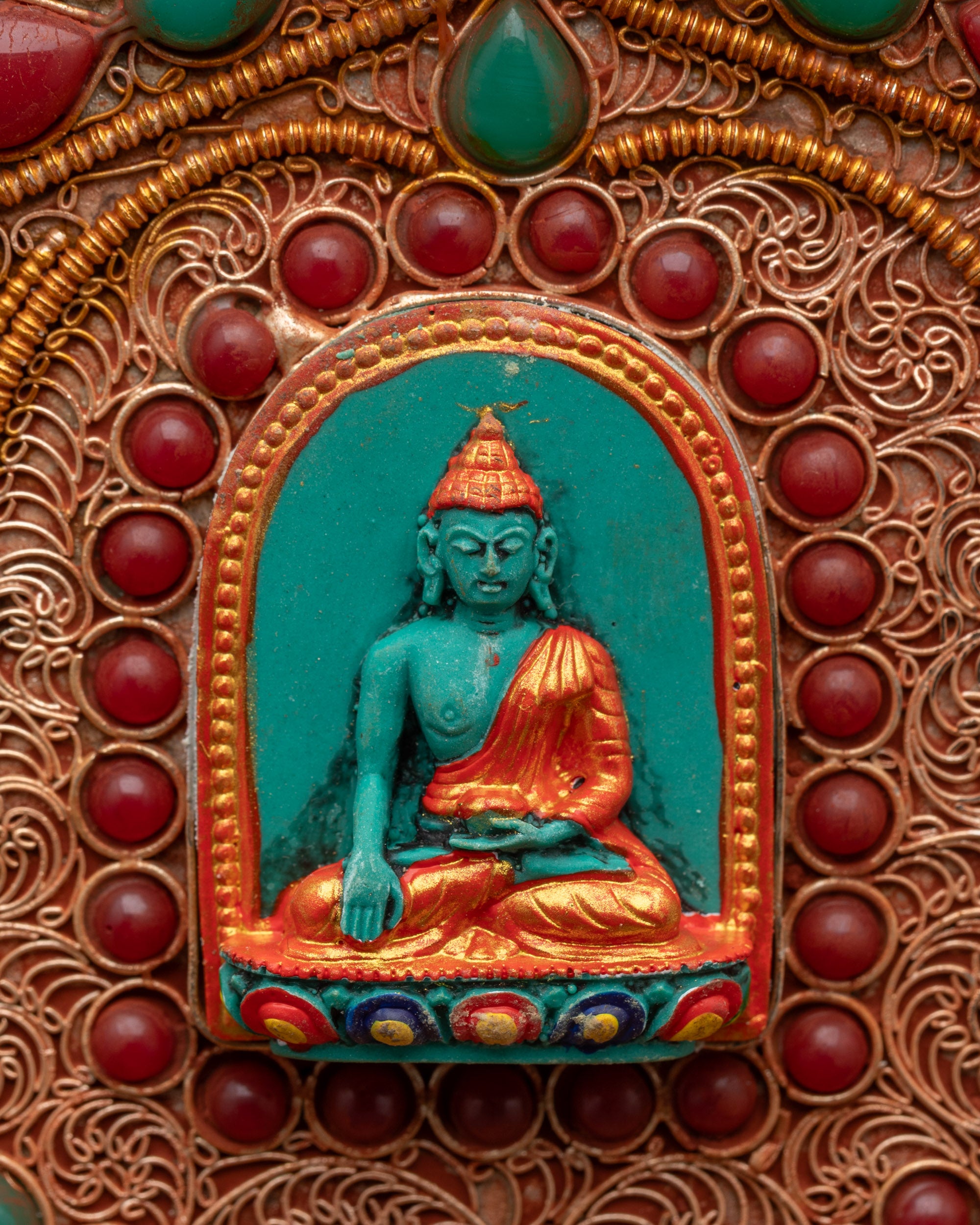 Back view of enthroned Kartika dagger showing Shakyamuni Buddha figures and Astamangala symbols