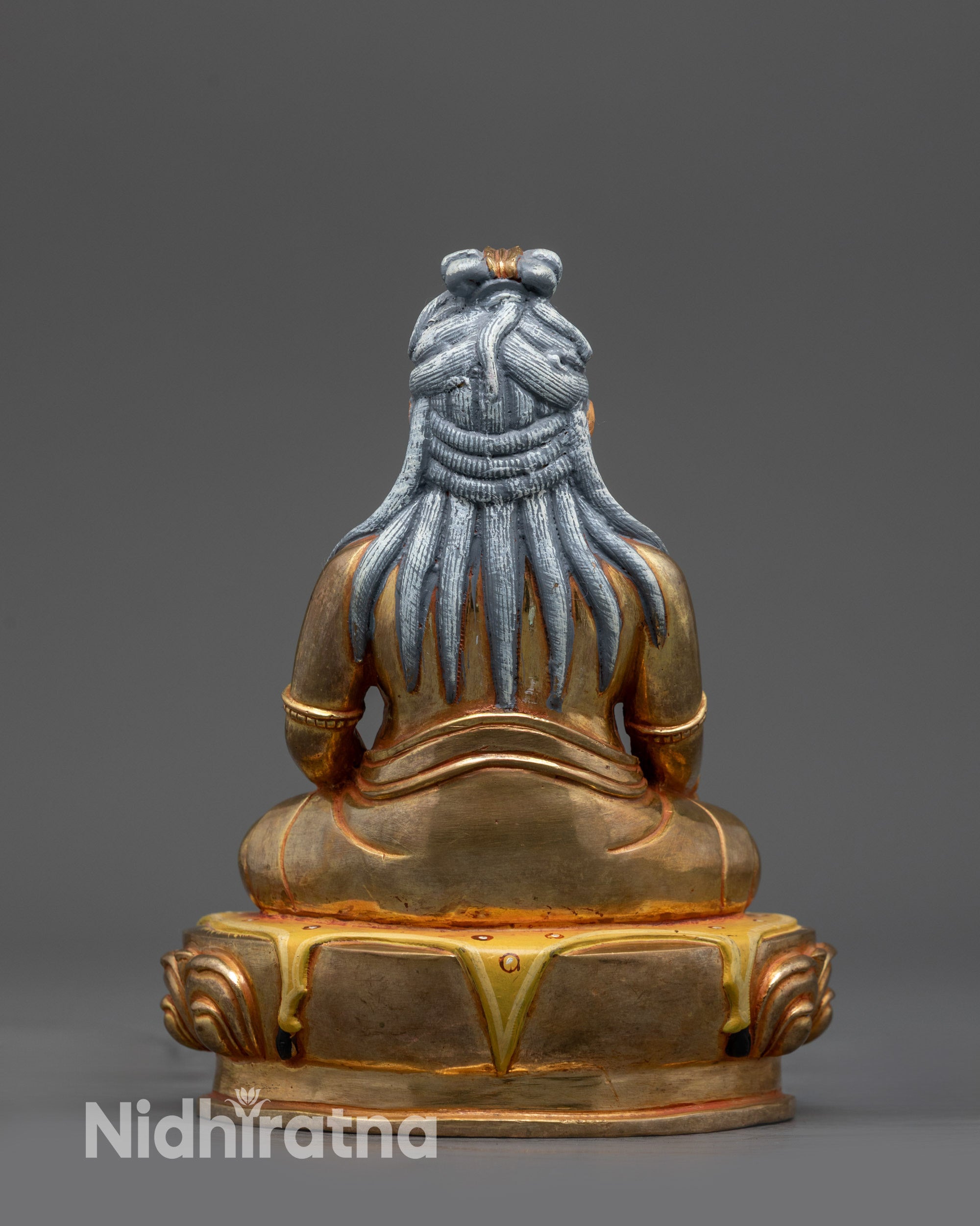 Back view of fire-gilded base and ornate carvings on Thang Tong Gyalpo Sculpture