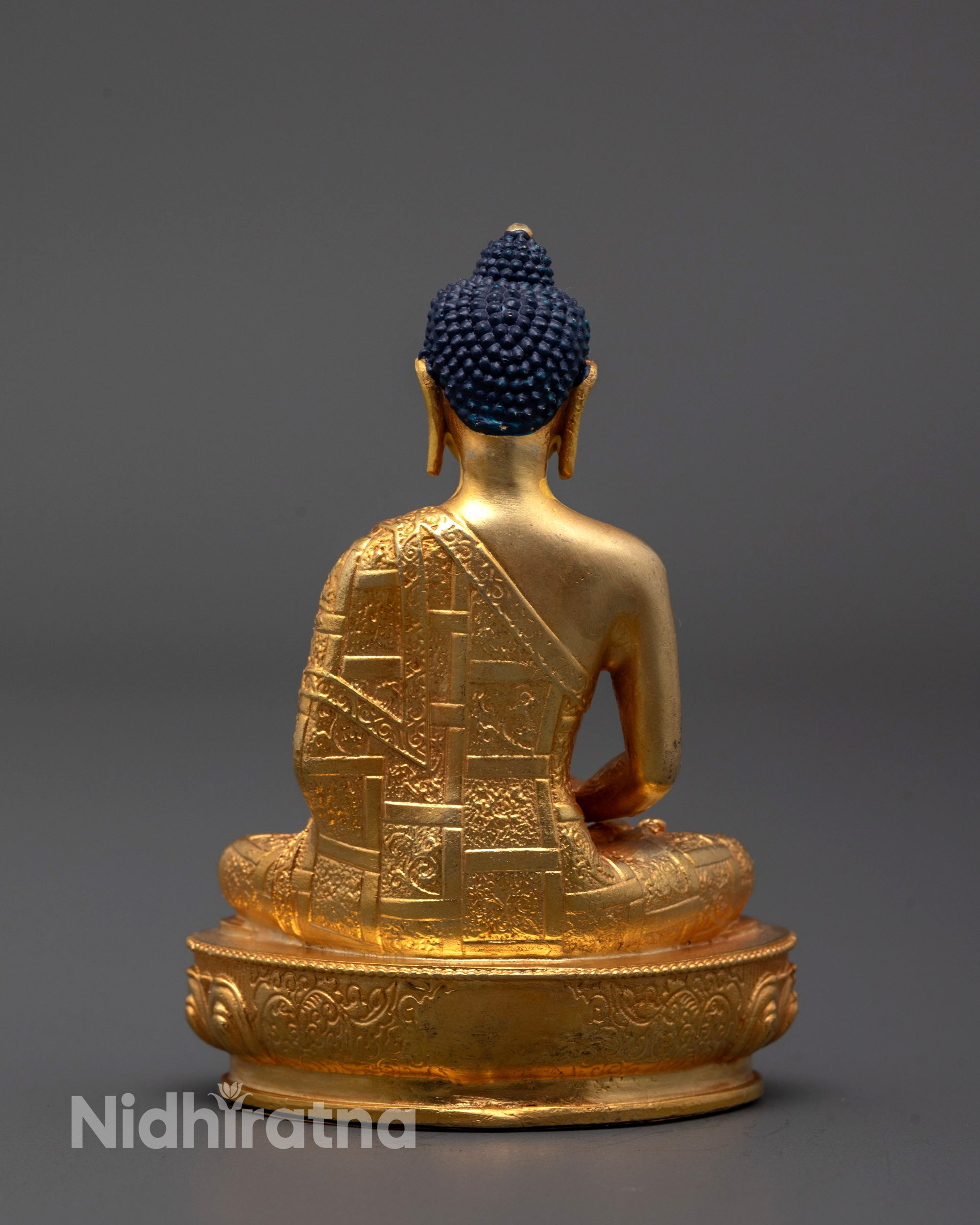 Back view of gold-plated Amitabha Buddha statue highlighting traditional craftsmanship
