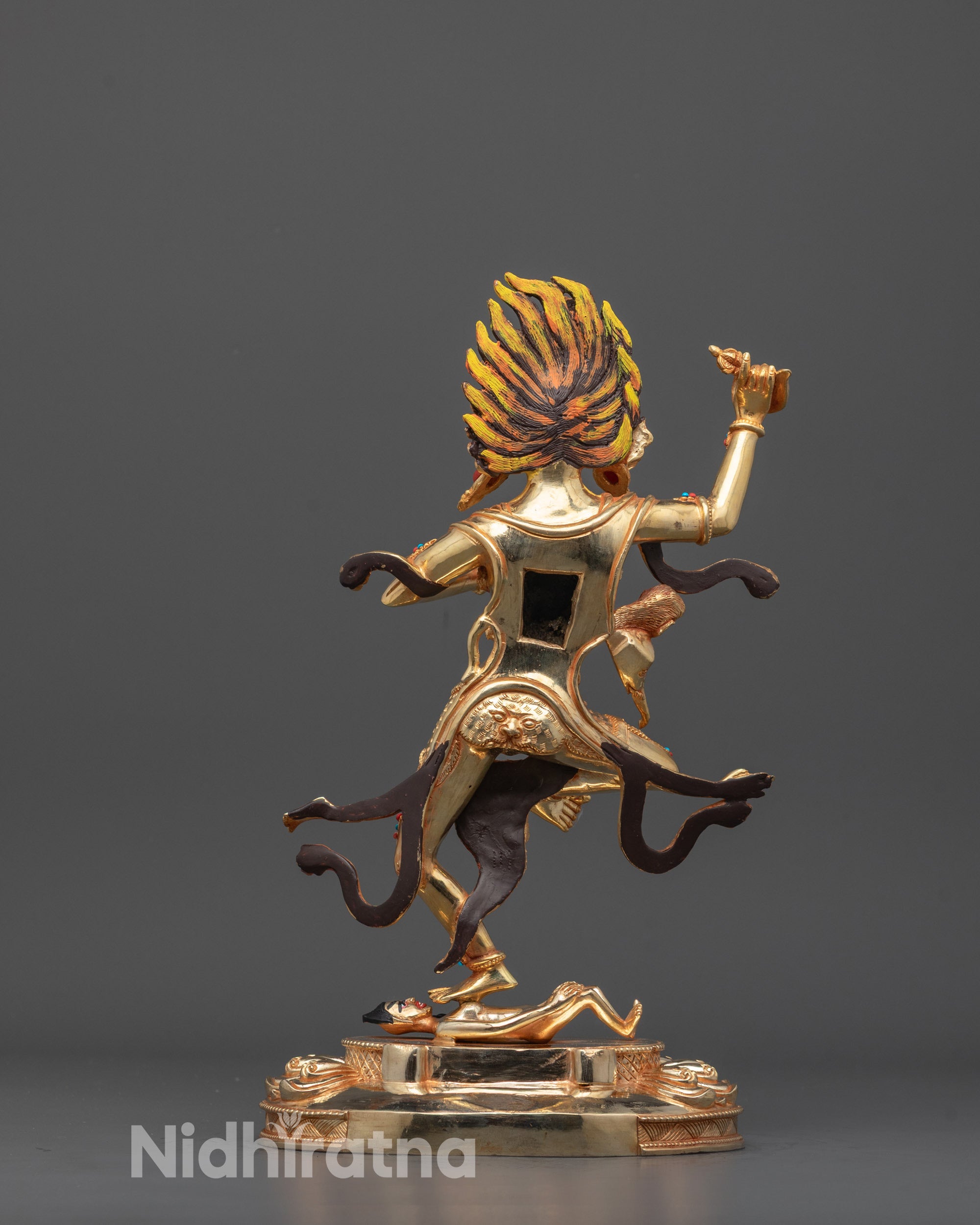 Back view of hand-carved Troma Nagmo Statue with hollow consecration chamber and gold finish
