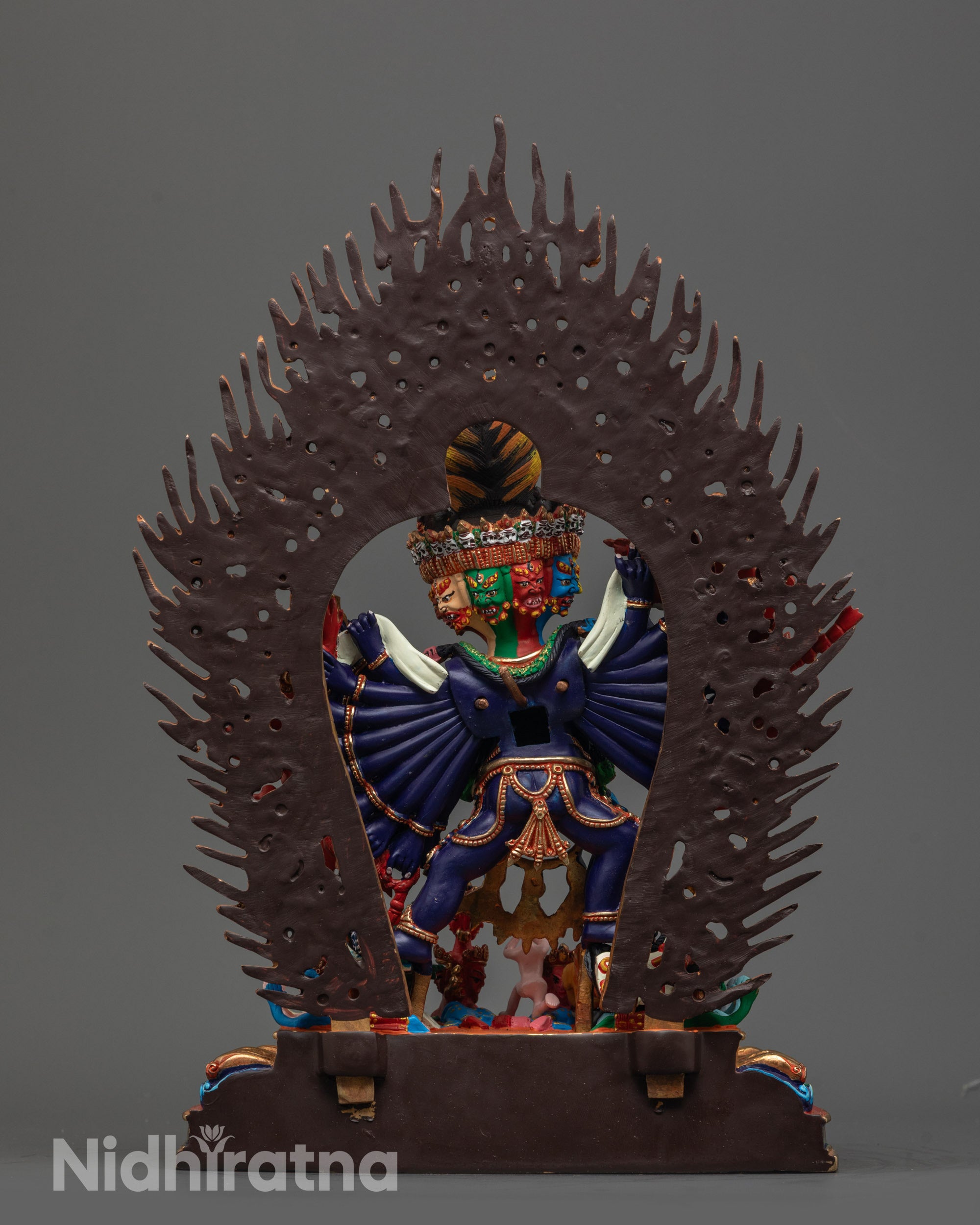 Back view of hand-carved Yamantaka Statue with fierce halo and intricate lotus base