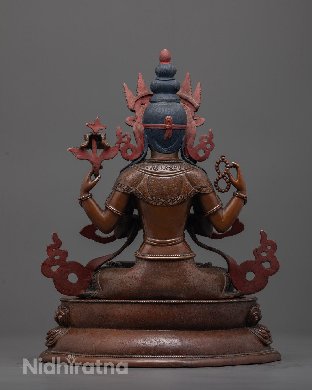 Back view of handcrafted Chenrezig statue from Nepal,