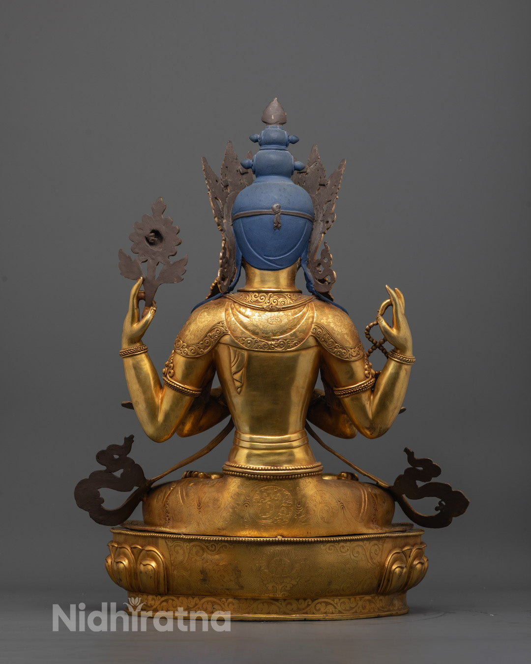 Back view of handcrafted Four-Armed Chenrezig Statue featuring hollow chamber