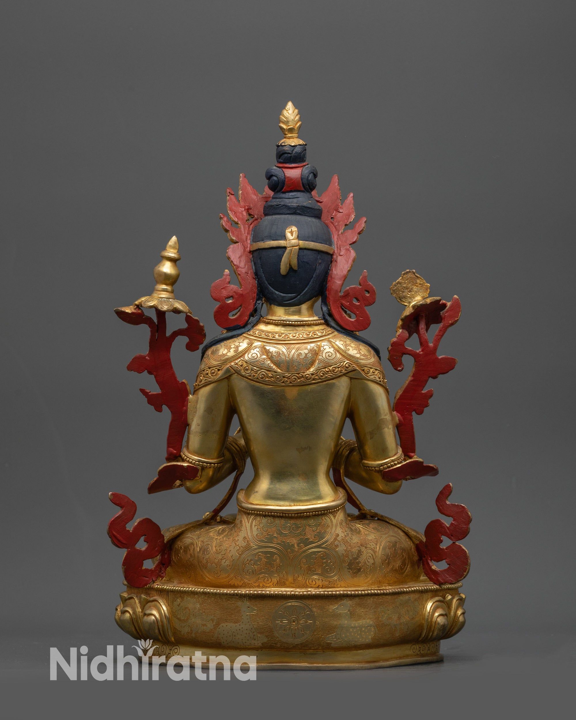 Back view of handcrafted Maitreya Buddha statue highlighting detailed robe and lotus pedestal