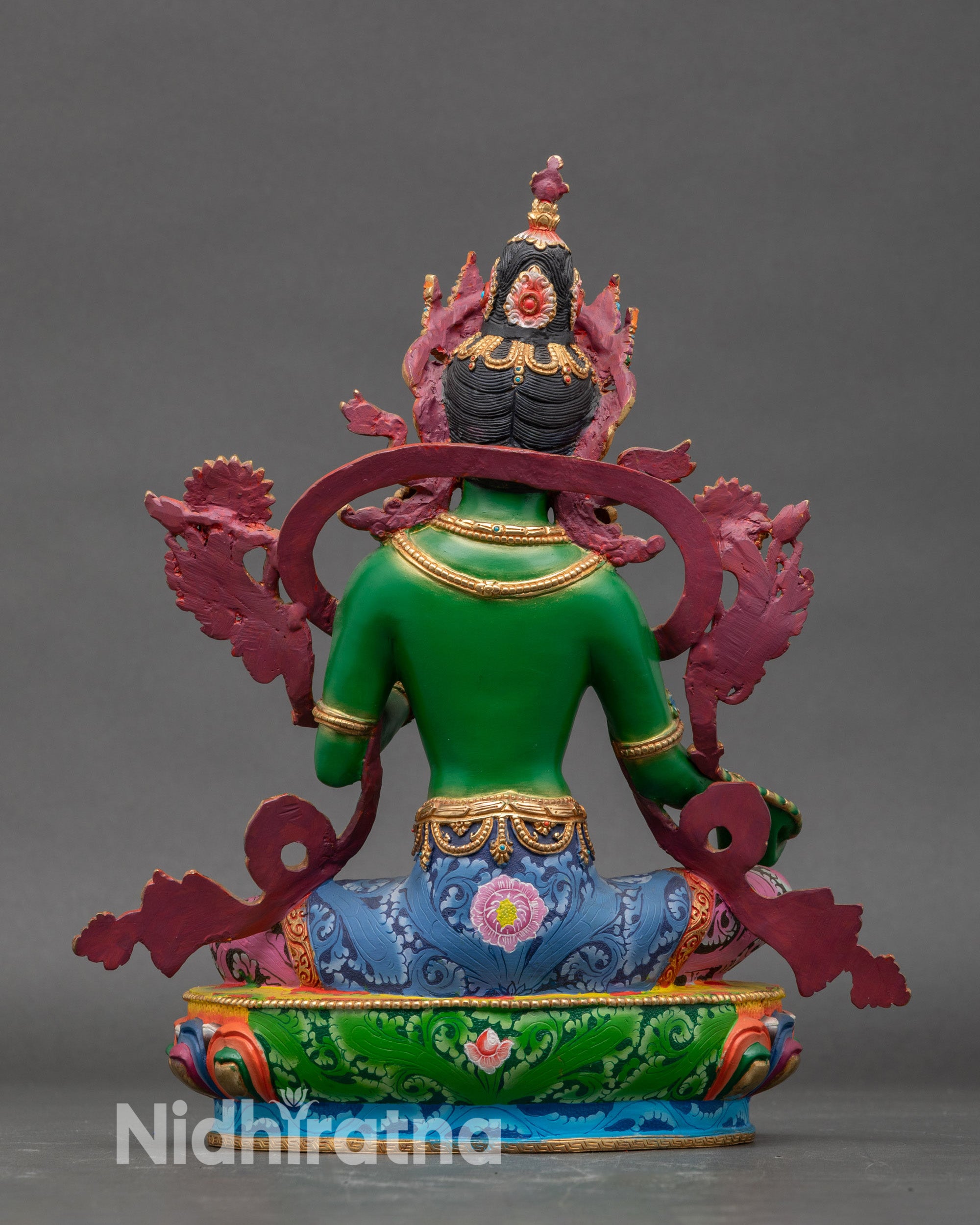 Back view of handcrafted Nepalese Green Tara statue, traditional lotus seat, spiritual home altar decor