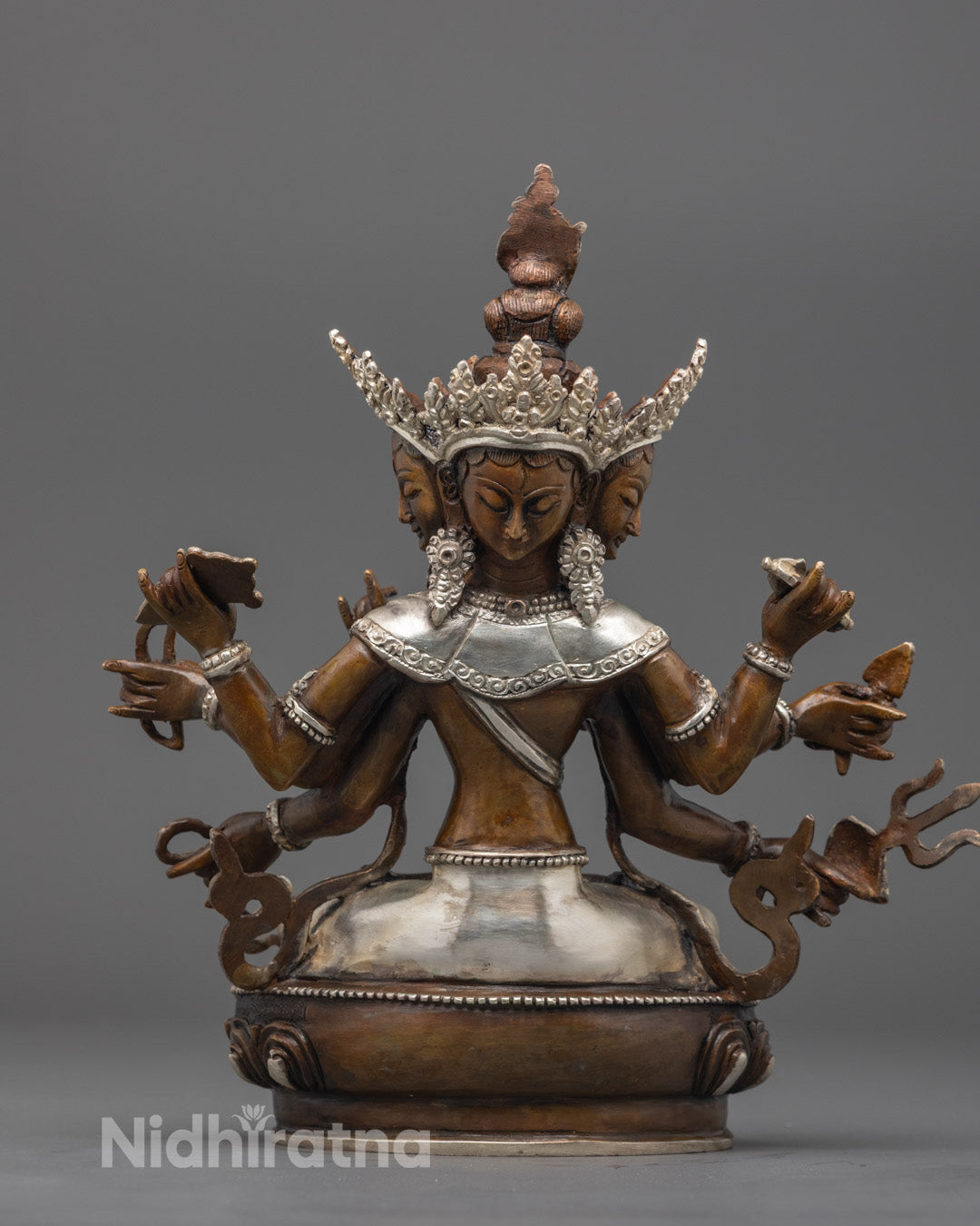 Back view of handcrafted Sitatapatra statue with intricate robe and lotus base carvings
