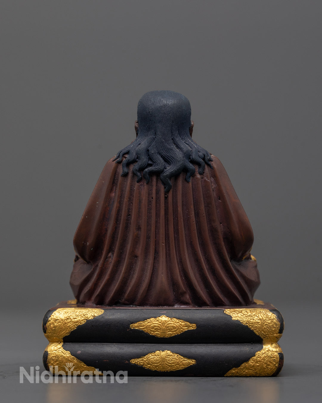 Back view of machine-made Marpha statue highlighting traditional Tibetan craftsmanship